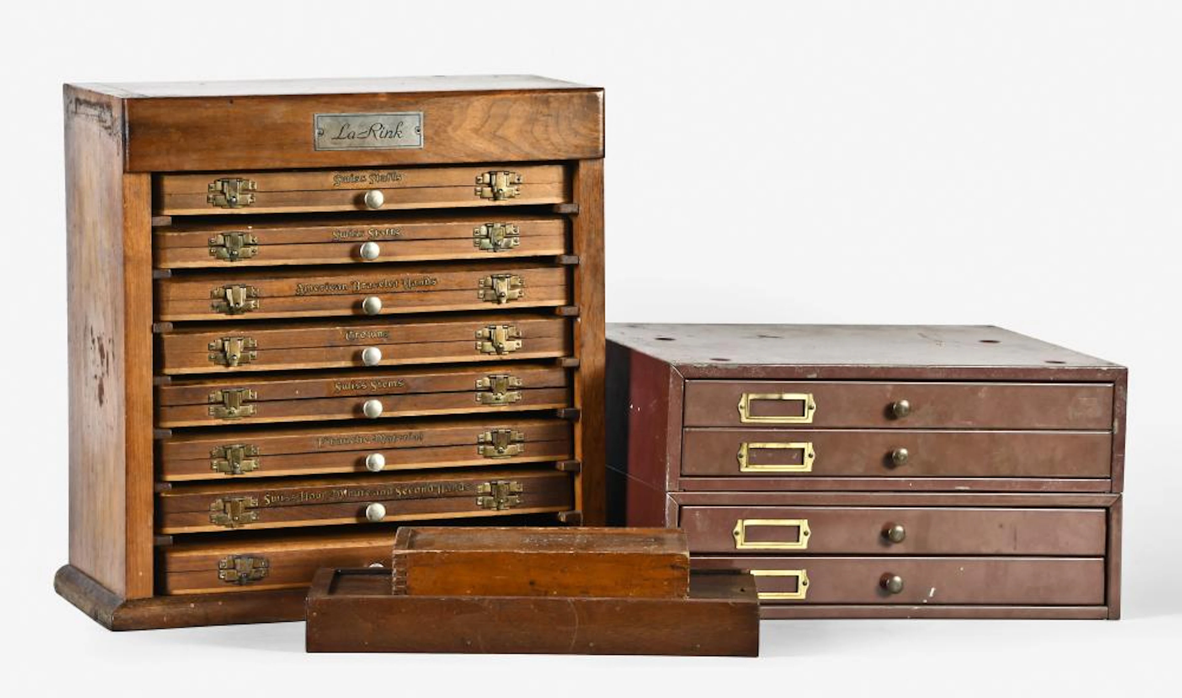 A lot of four boxes and cabinets containing wrist watch material