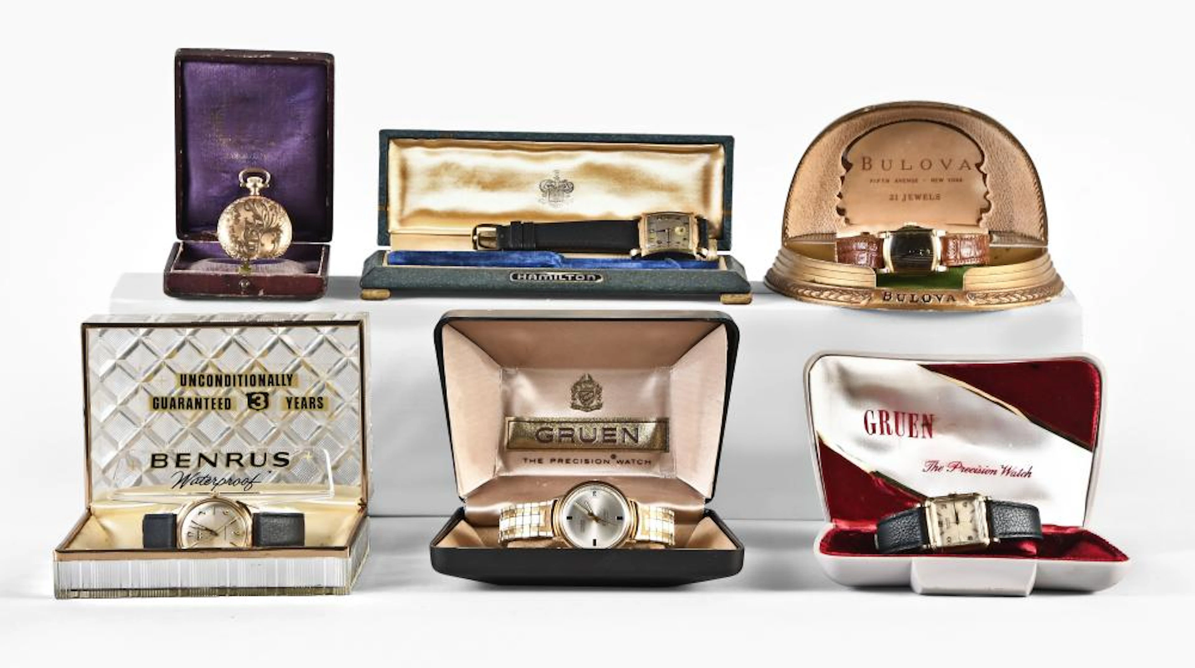 A lot of five wrist watches and a pocket watch, all with boxes