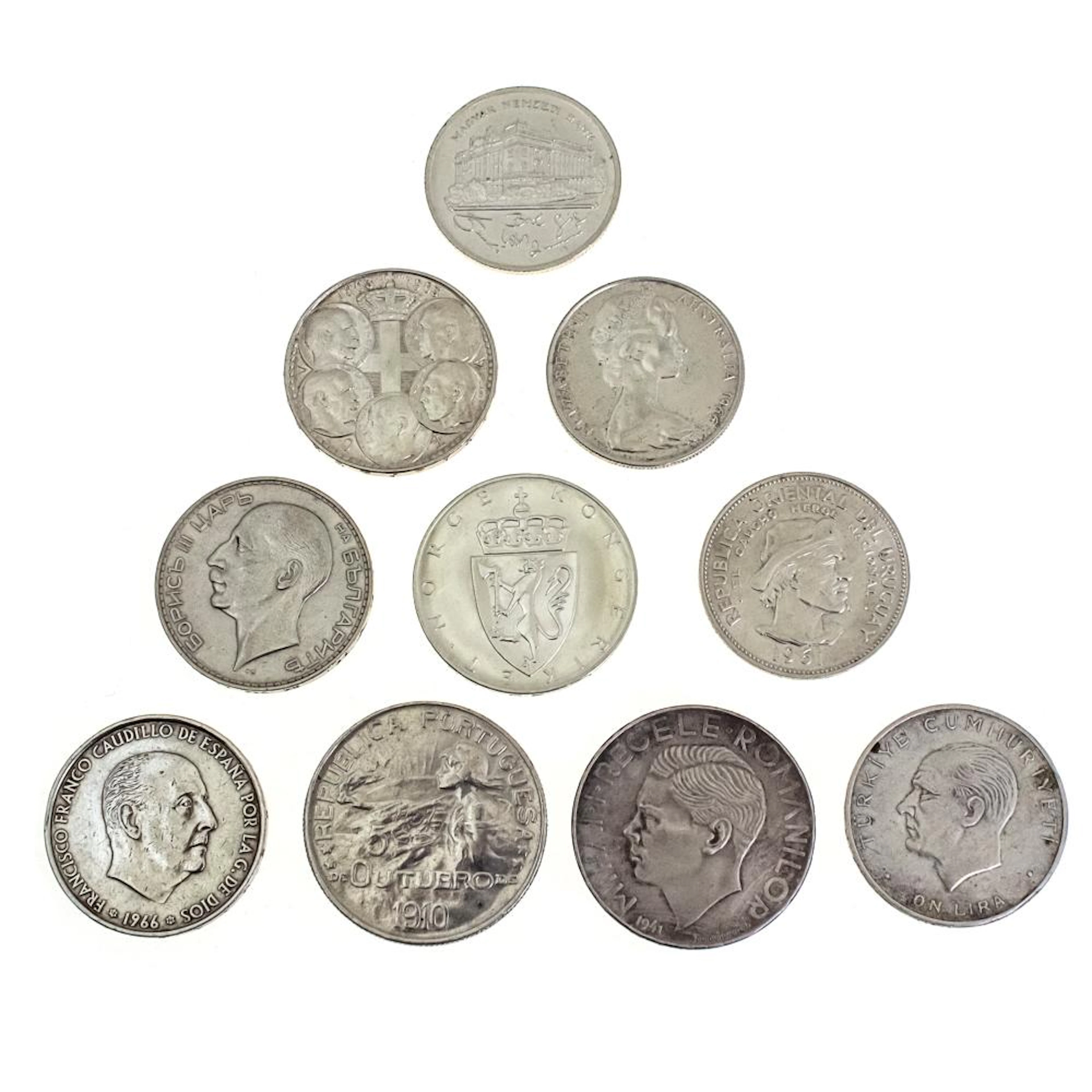 TEN SILVER COINS FROM AROUND THE WORLD.