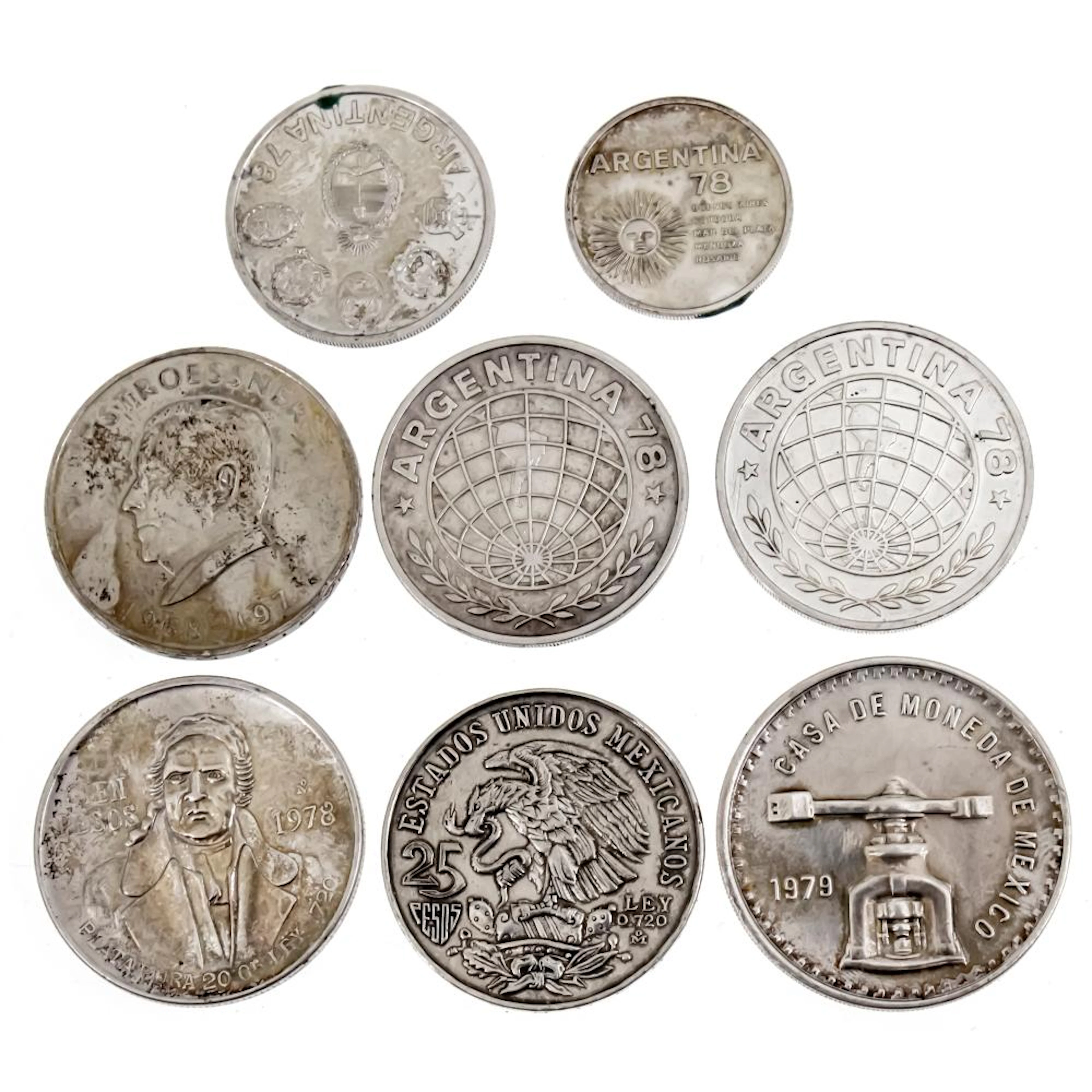 EIGHT SILVER COINS.