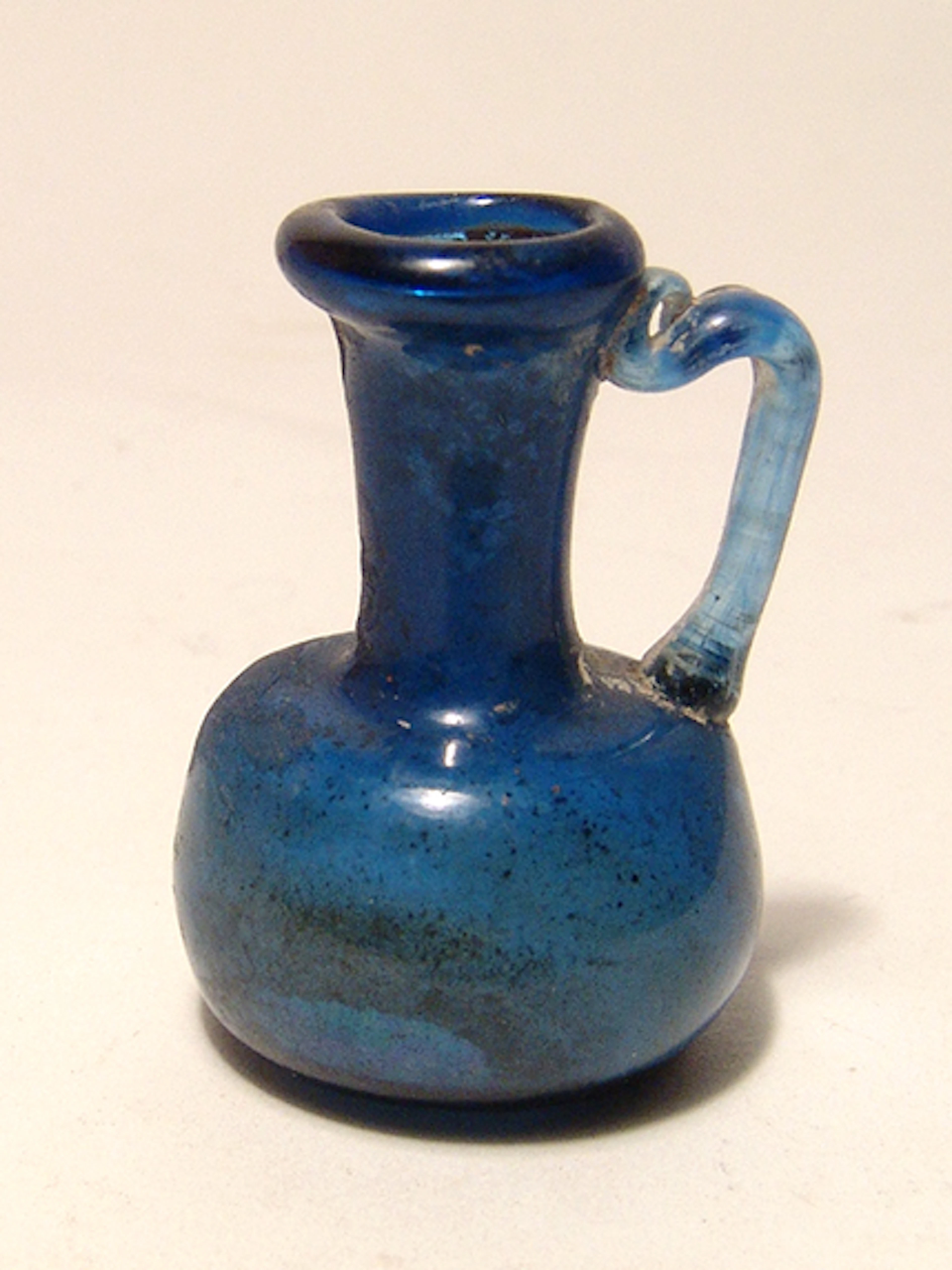 A miniature Roman cobalt blue glass vessel