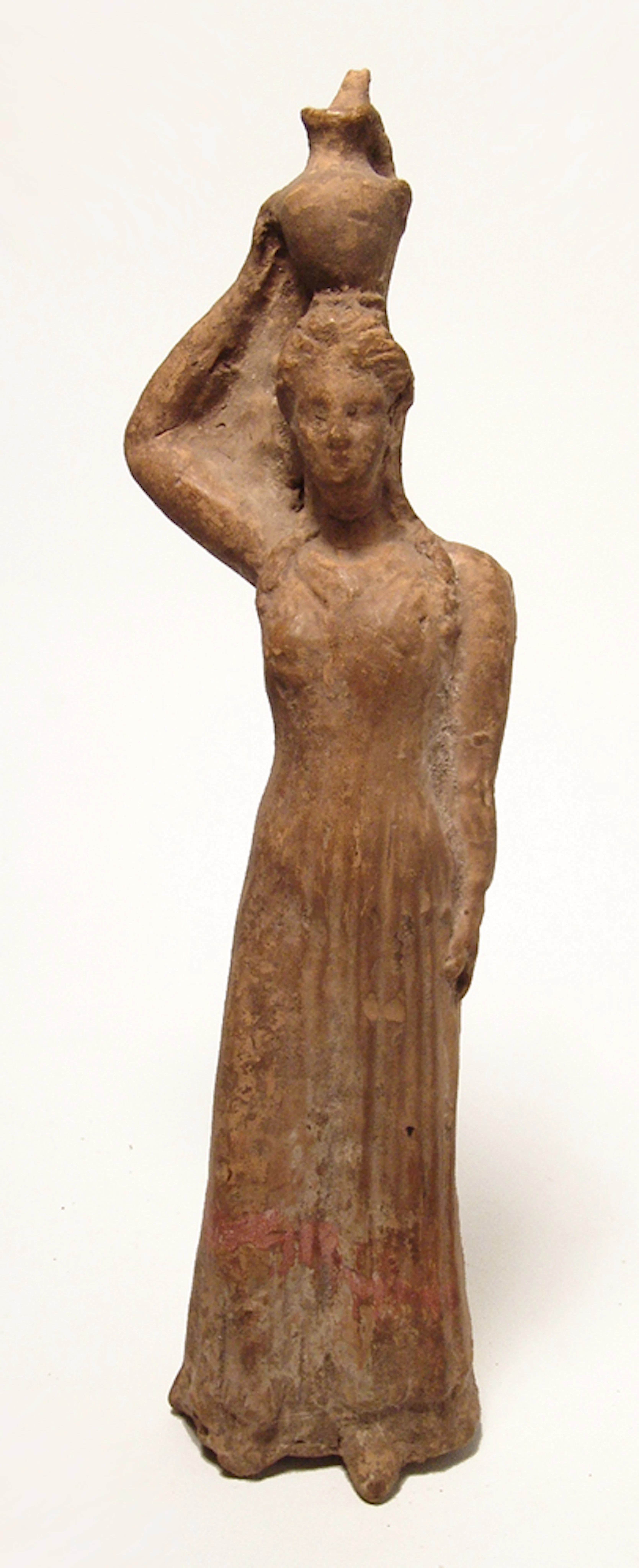 A lovely Greek terracotta figurine of a robed woman