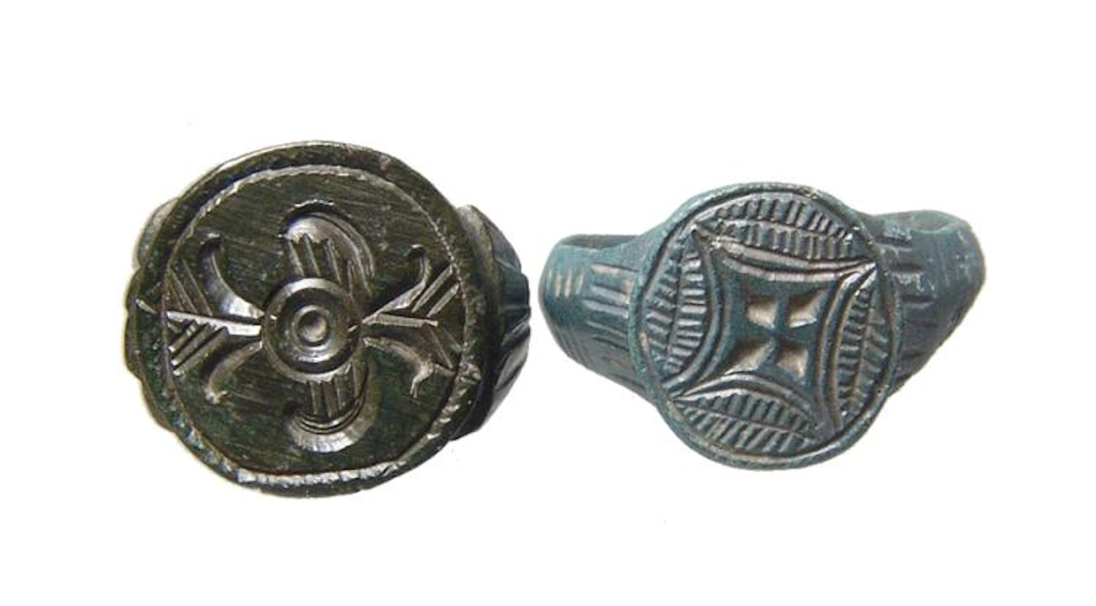 A pair of antique bronze rings