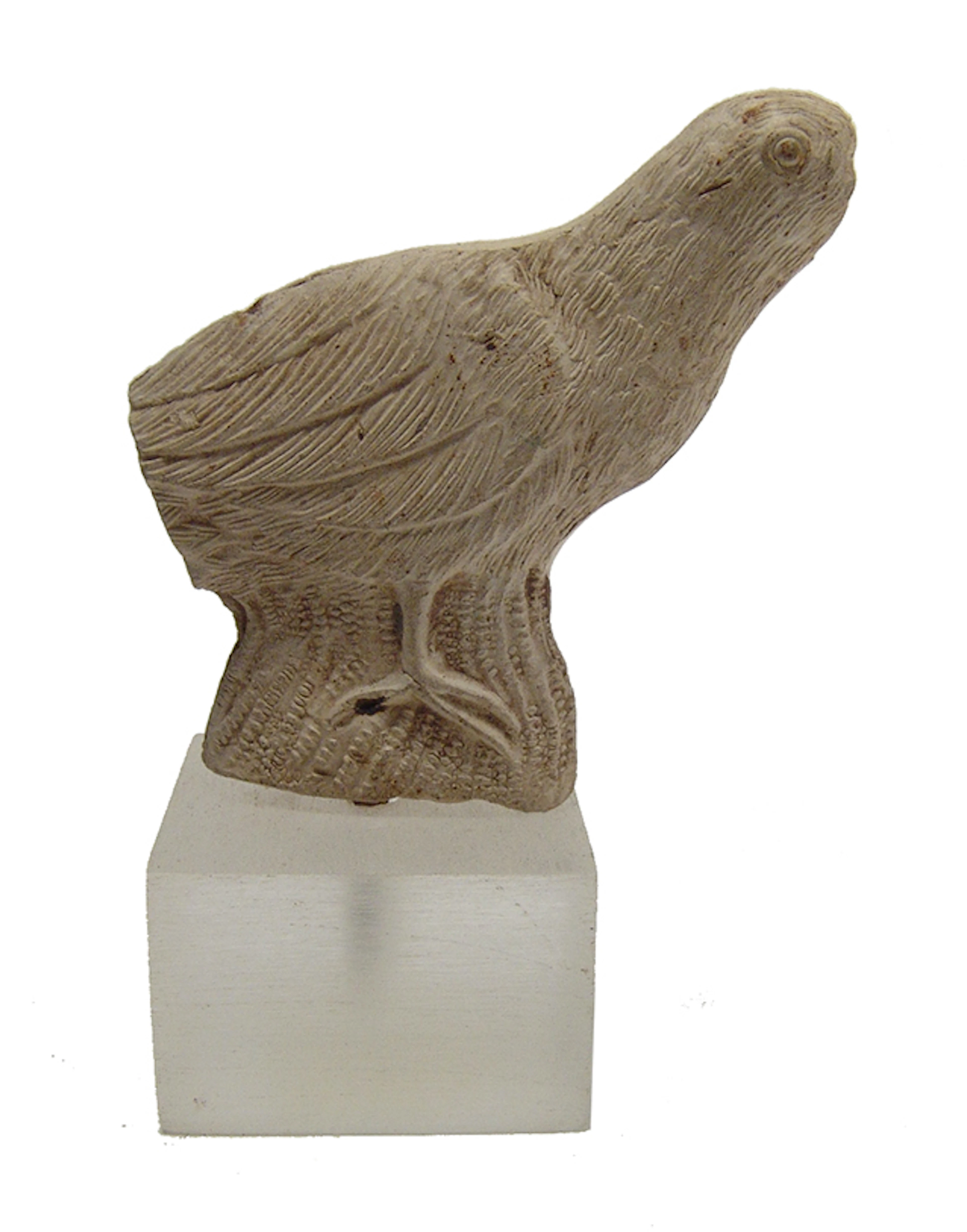 An Egyptian stucco figure of a bird, Late Period