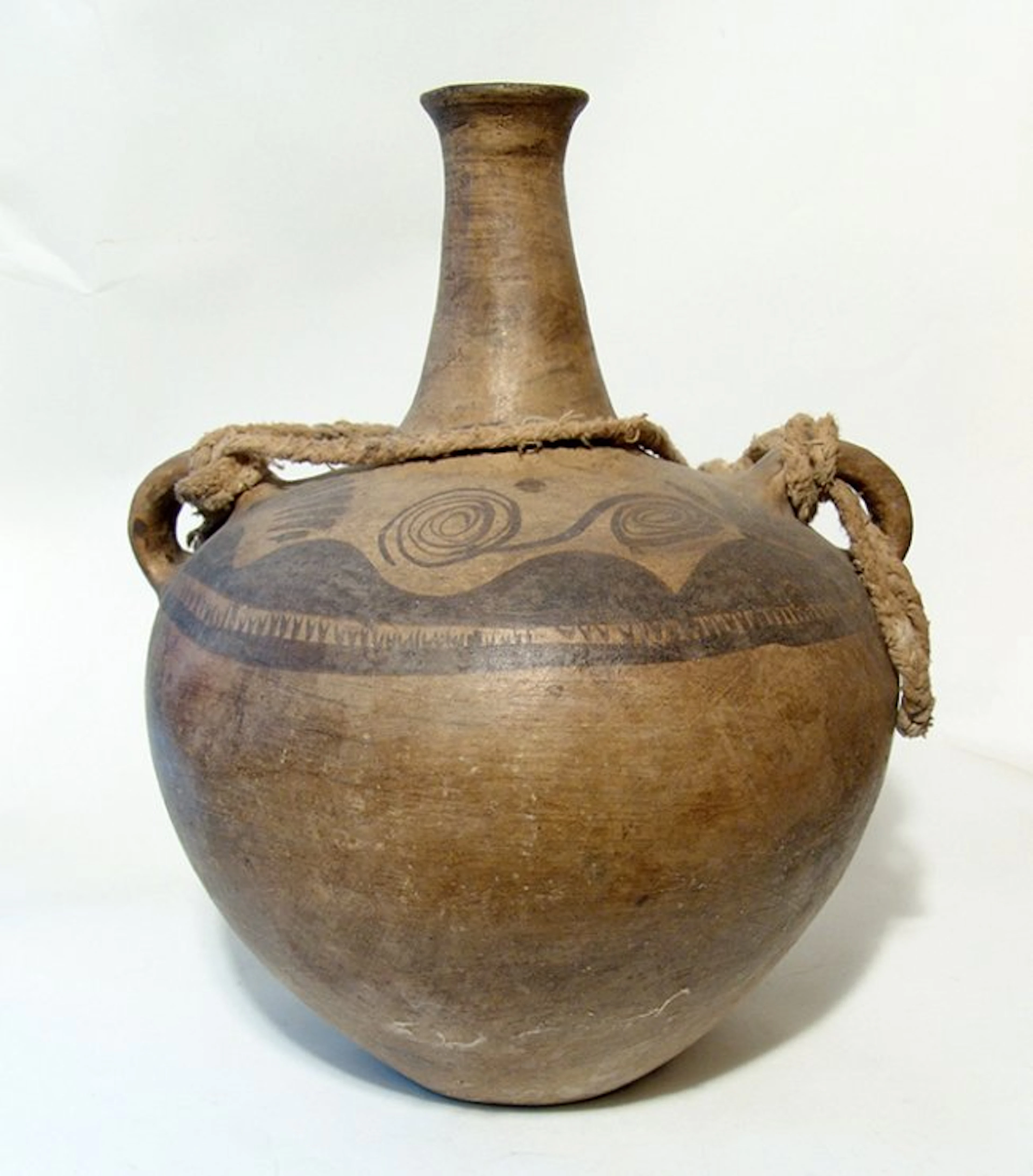 A very large antique Asian spouted jar