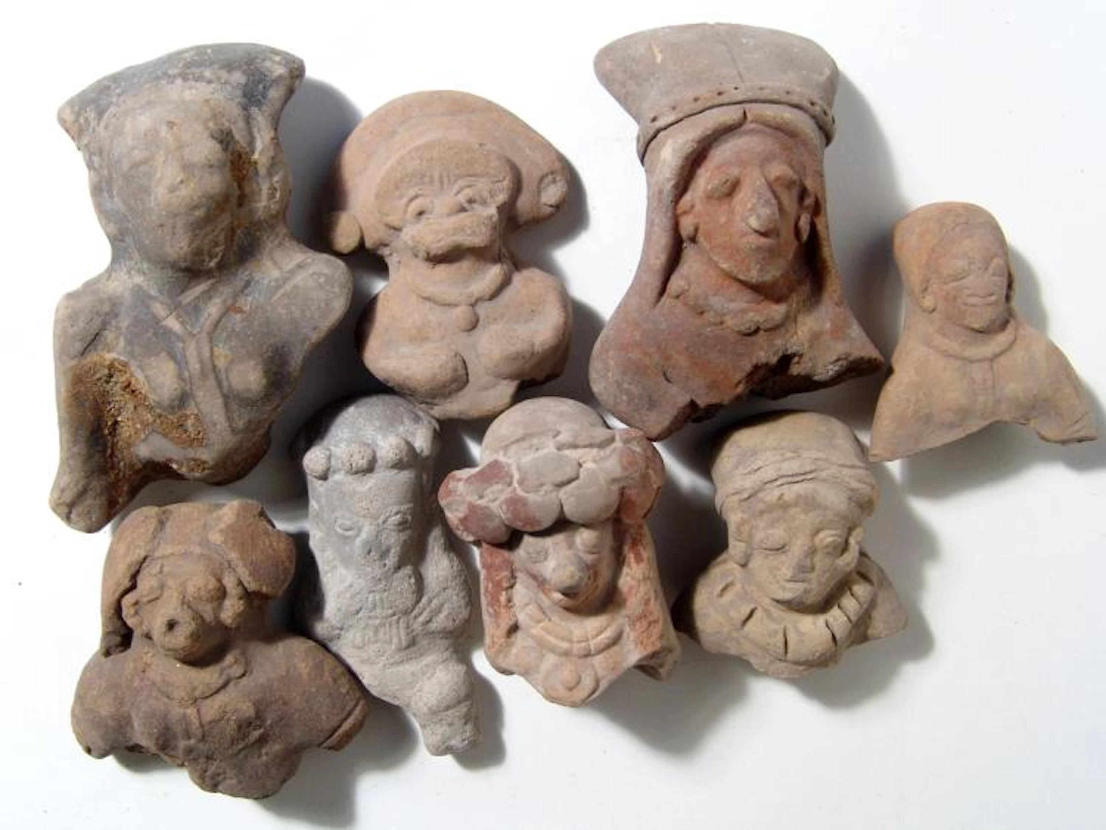 A group of 8 Ecuadoran ceramic heads