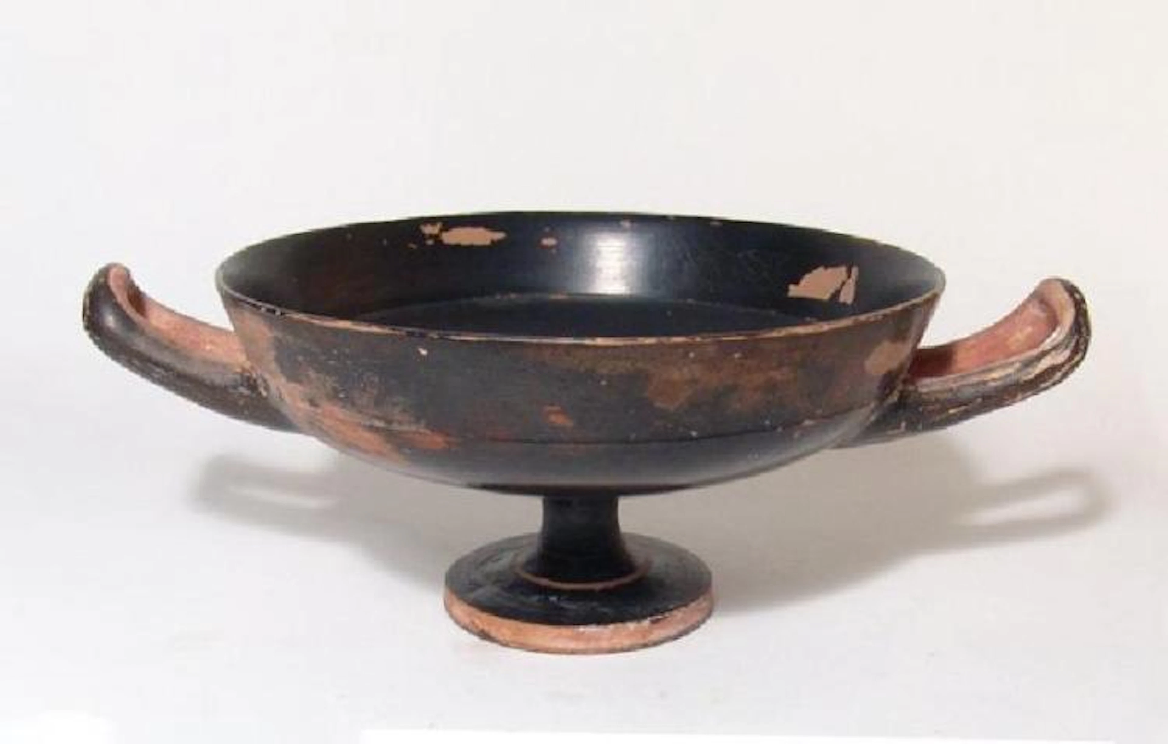 A large Greek black-glazed kylix