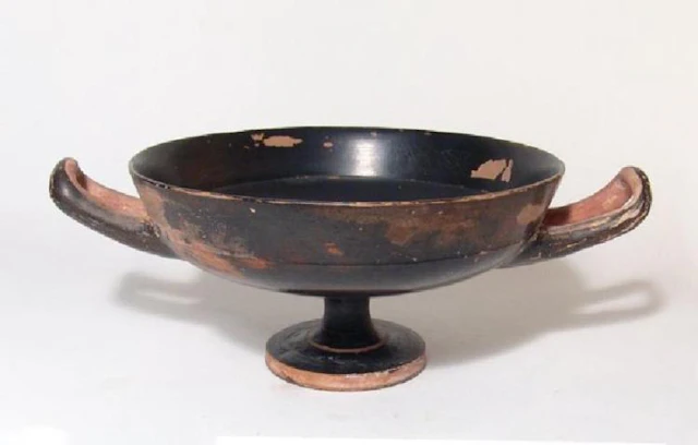 A large Greek black-glazed kylix
