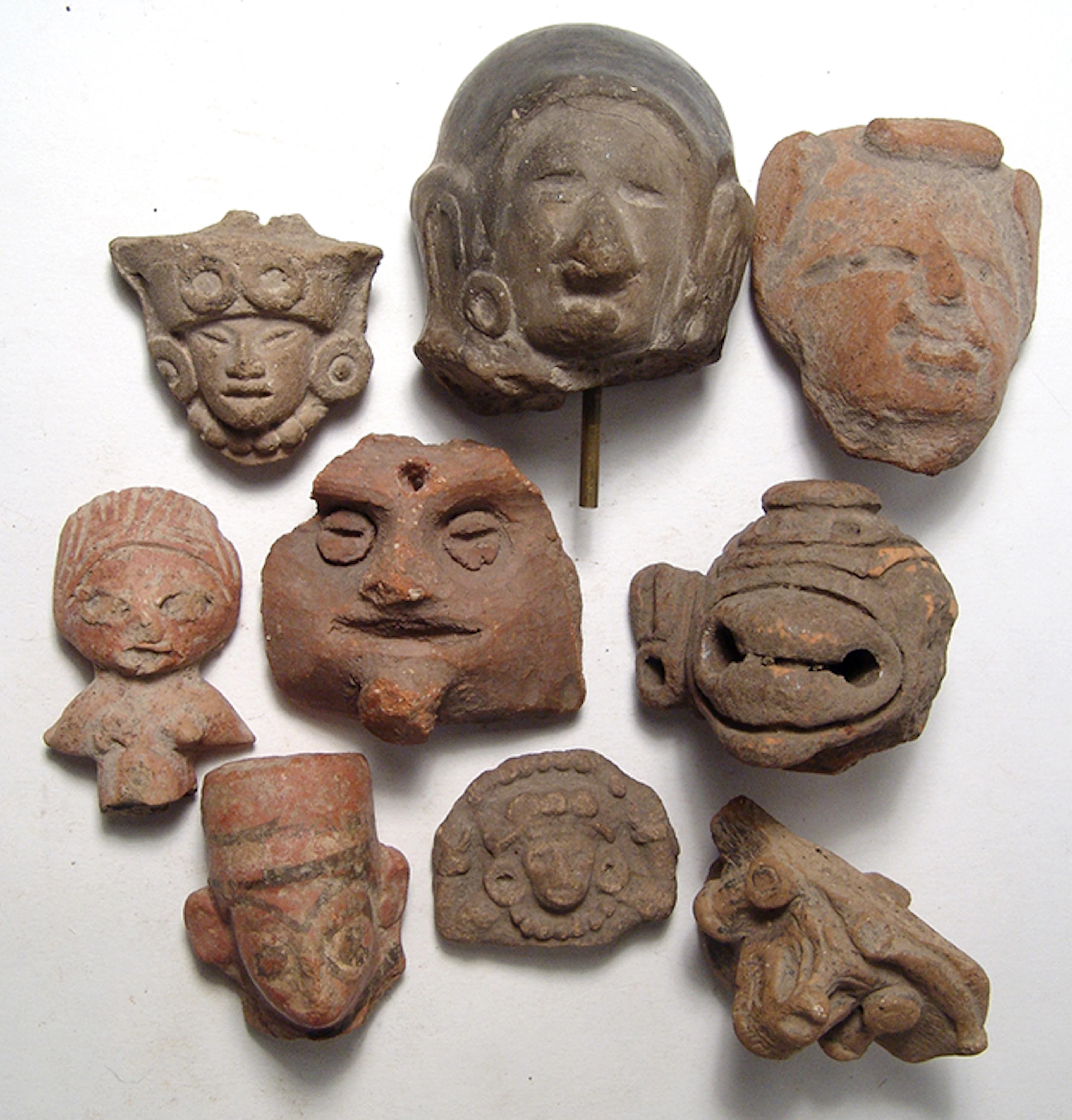 A group of 9 well-detailed Pre-Columbian heads, Mexico