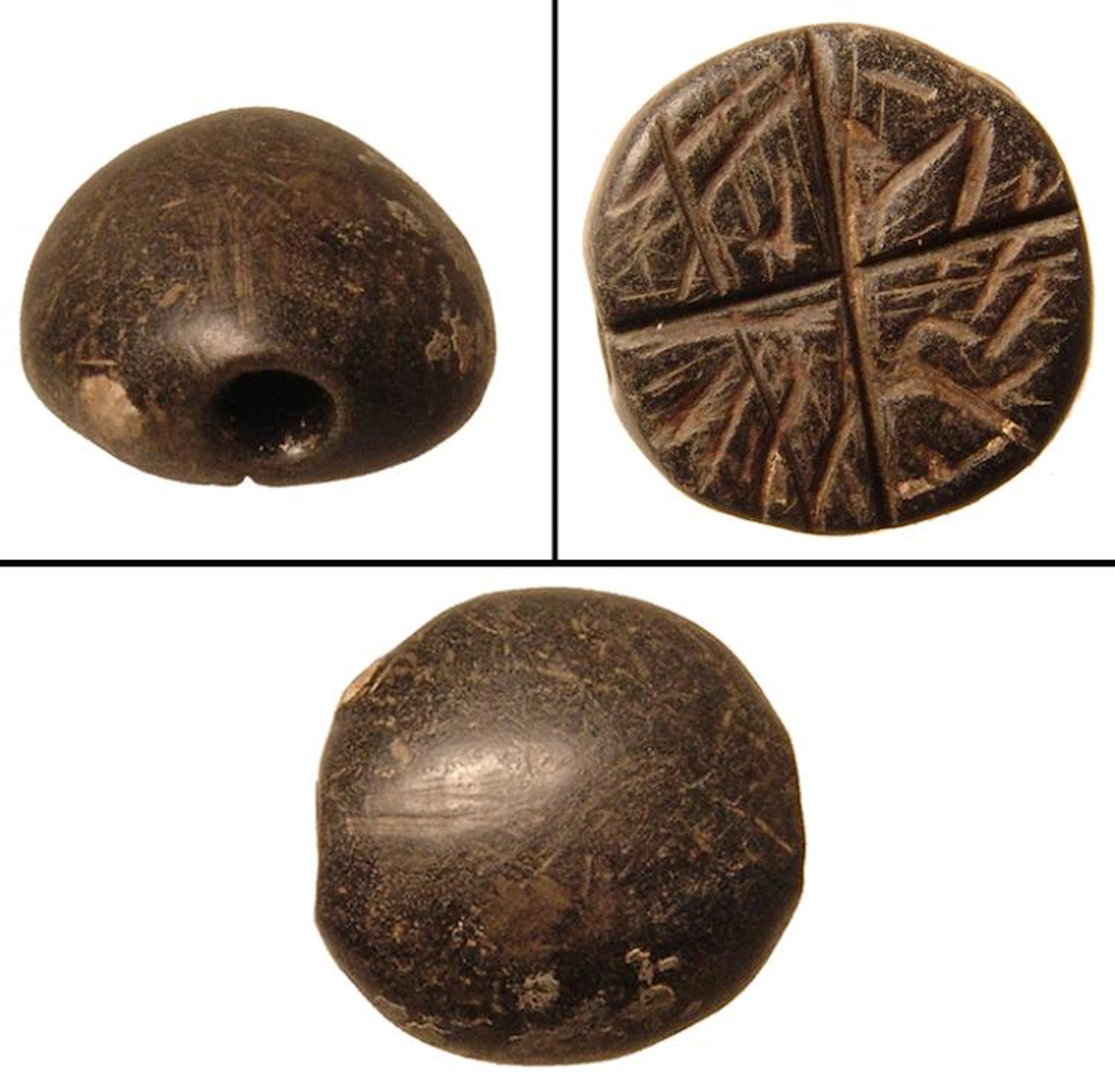 A Mesopotamian black serpentine stamp seal