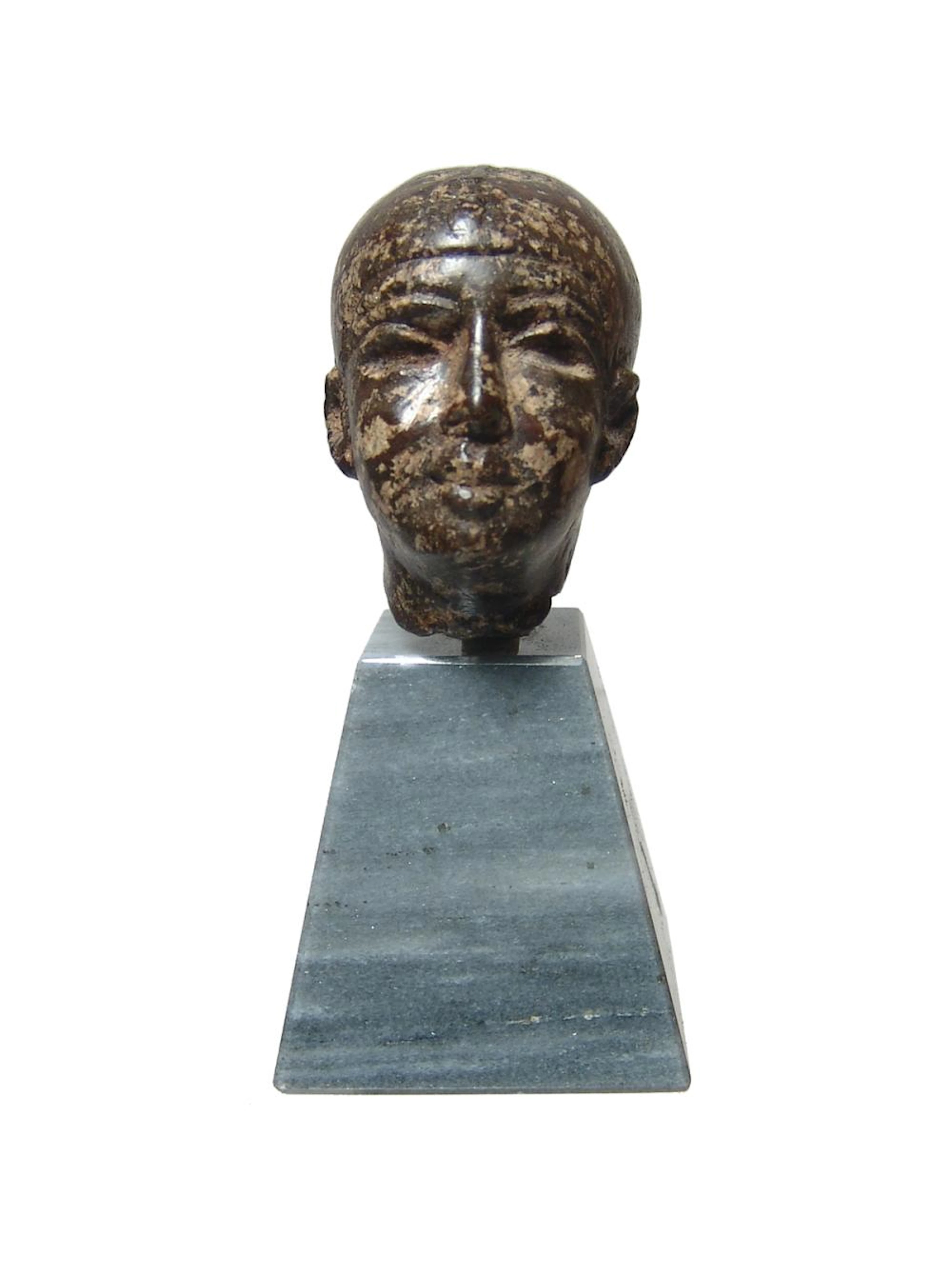 Choice Egyptian porphyry head of a Ptah, Late Period