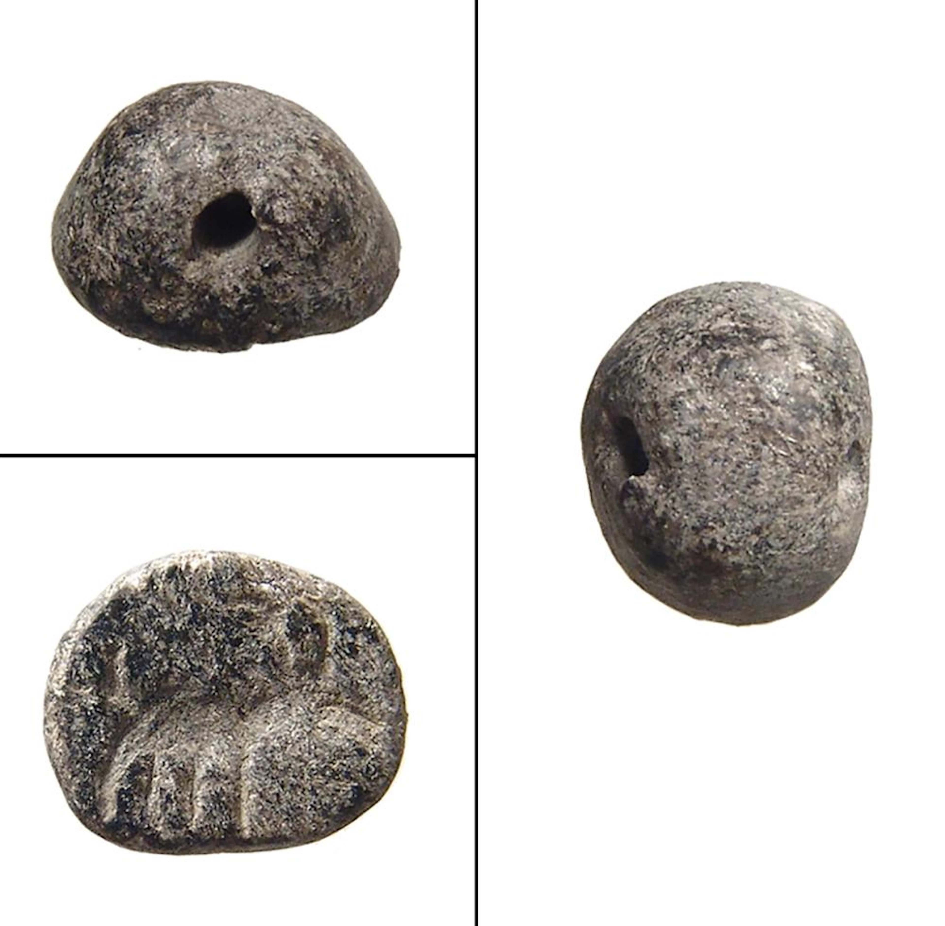 A Mesopotamian grey serpentine stamp seal