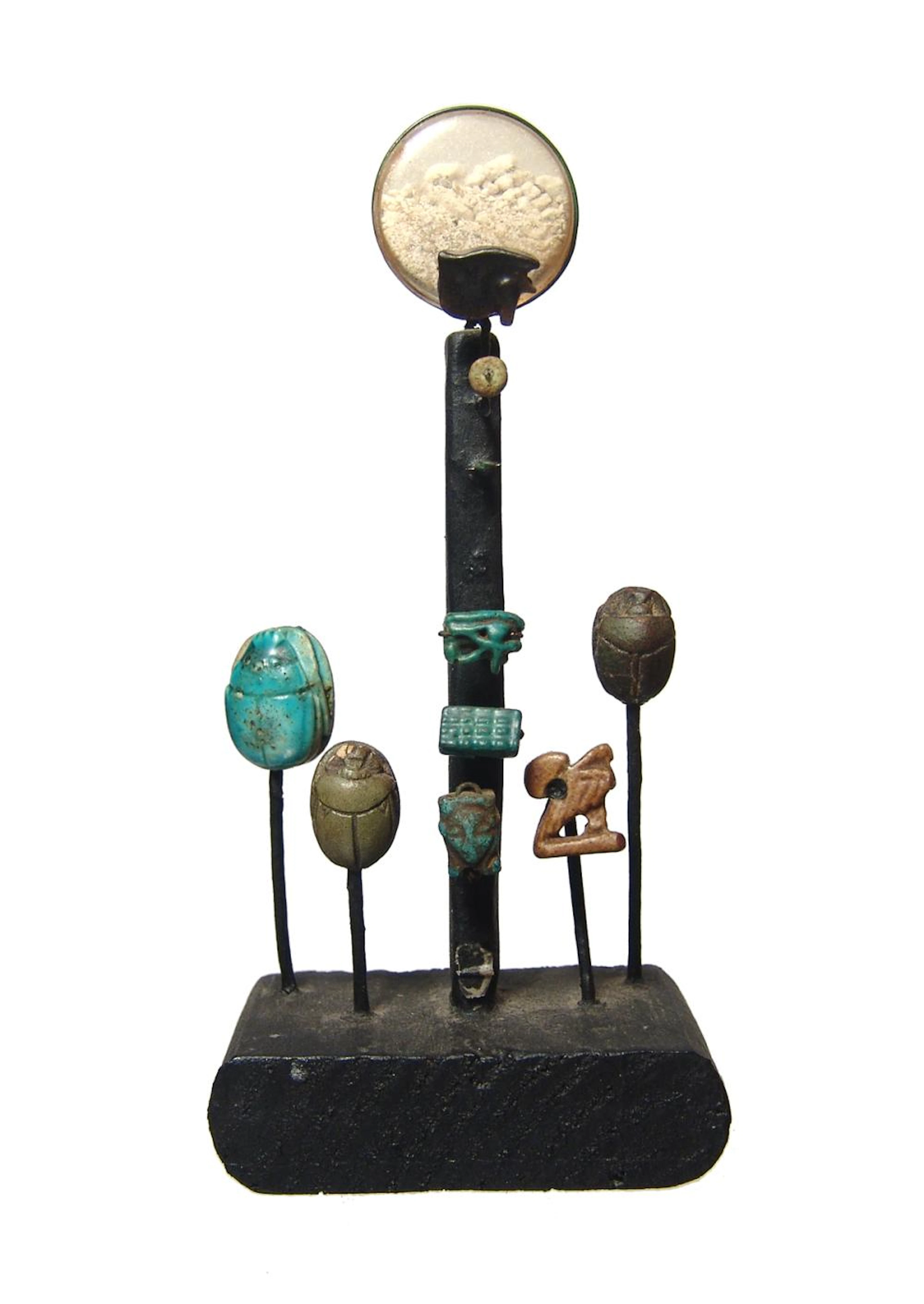 Decoratively mounted group of Egyptian faience objects