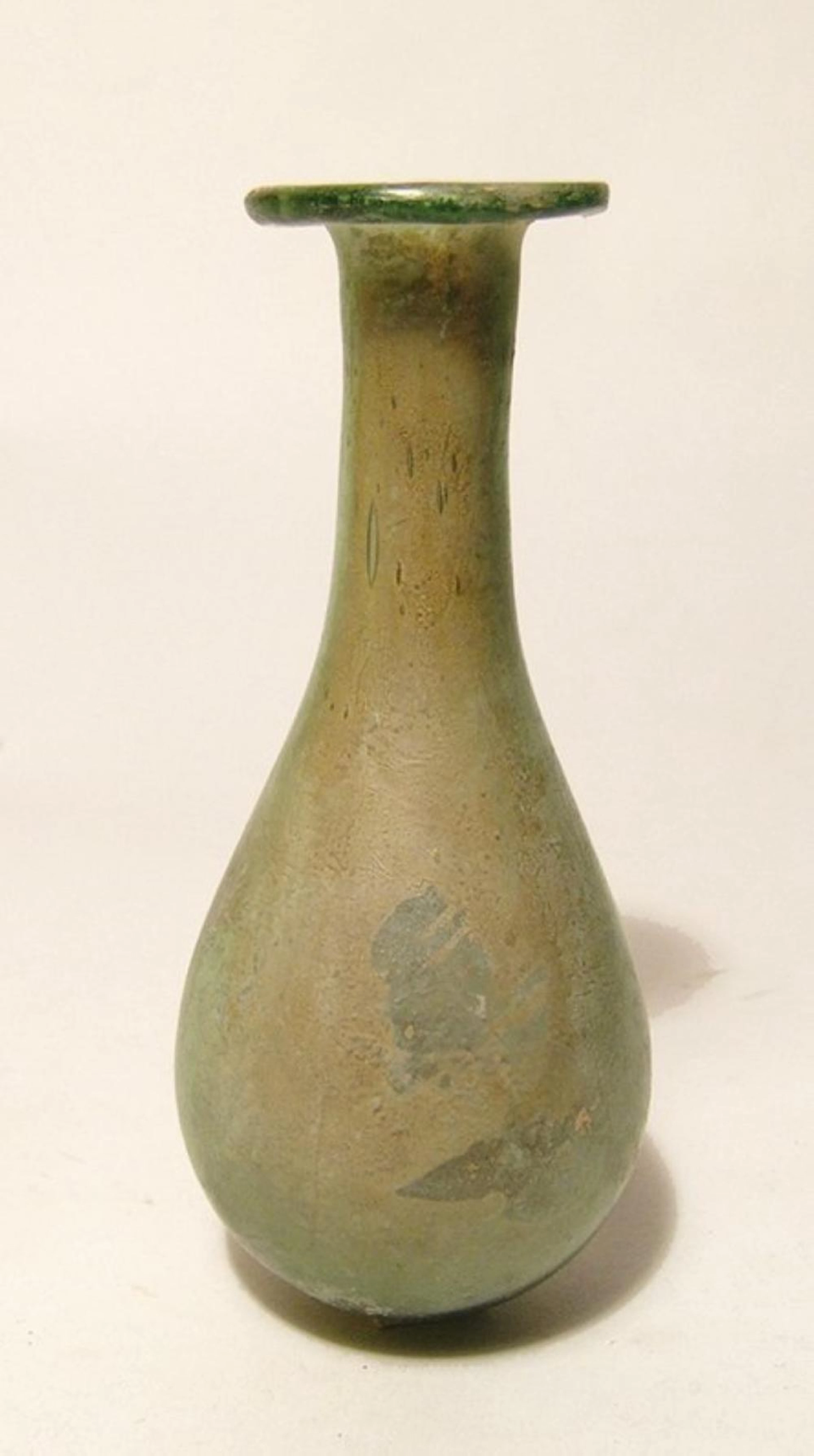 An attractive Roman green glass bottle