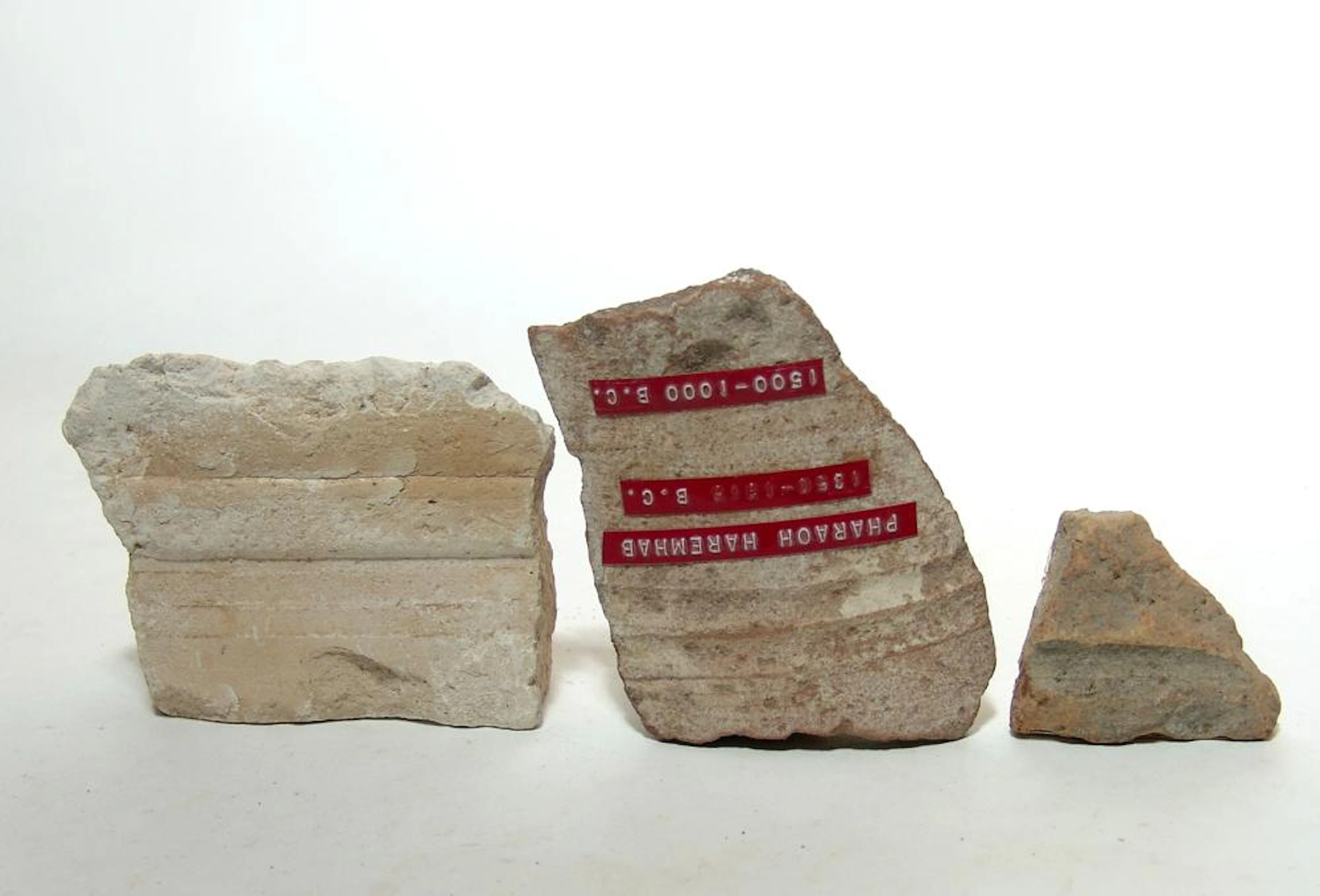 Stone and ceramic fragments with old collection labels