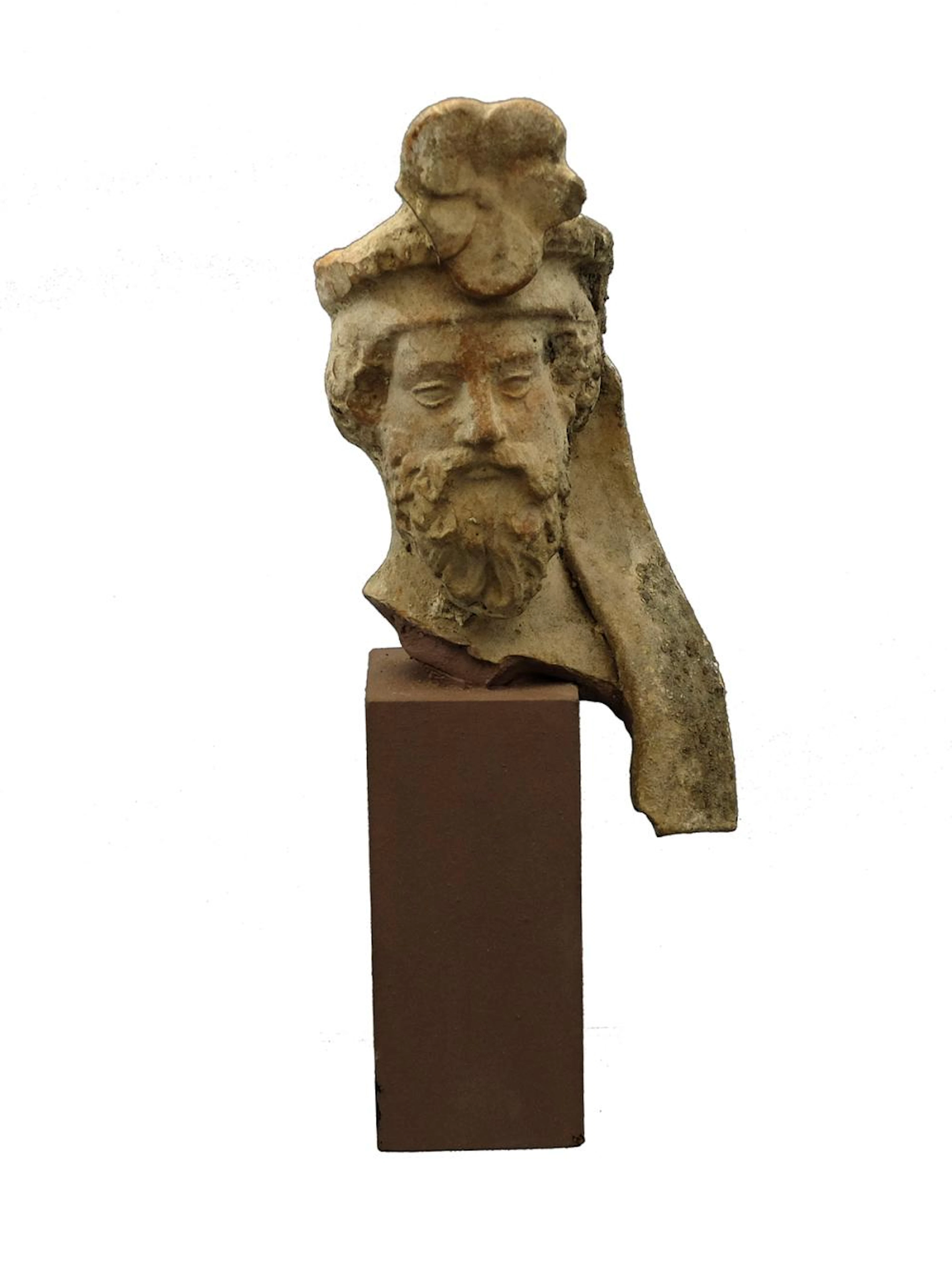 A Greek terracotta head of a bearded ma
