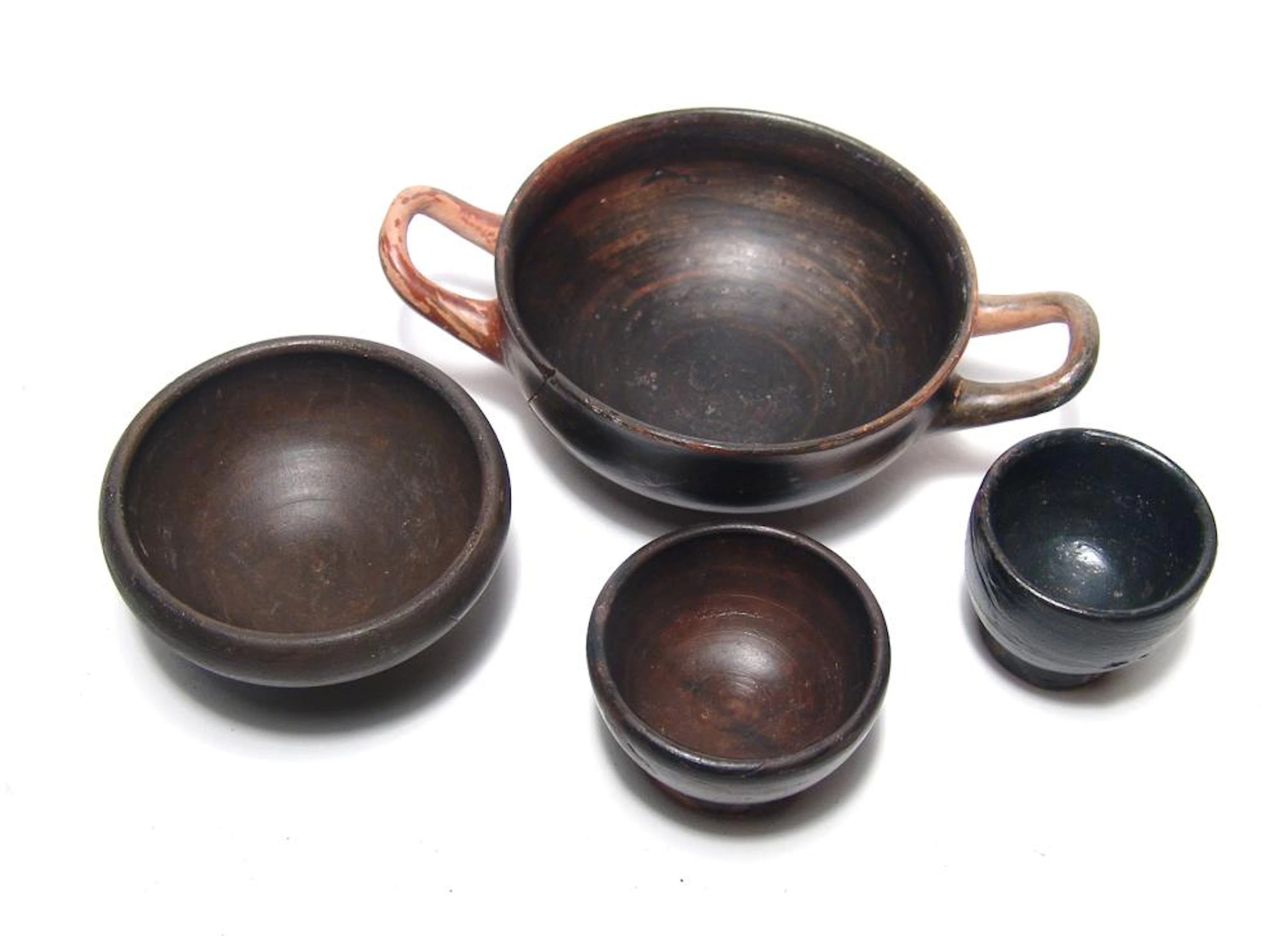 A lot of 4 Greek black-ware pottery vessels