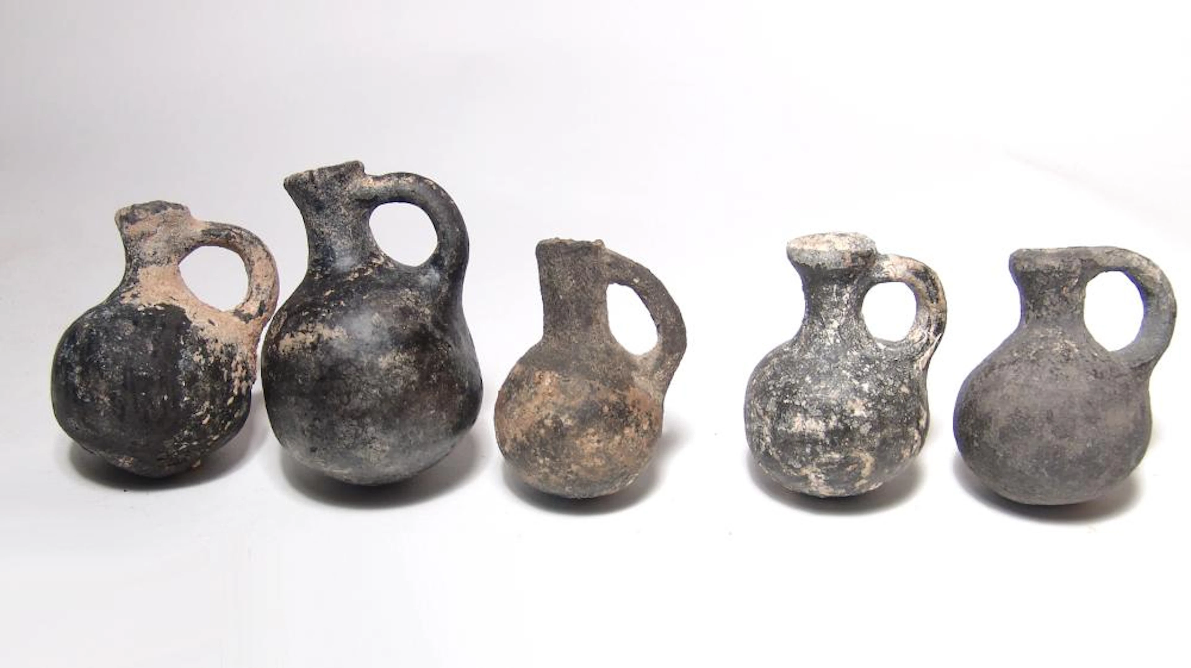 A lot of 5 Iron Age Holy Land black ware juglets