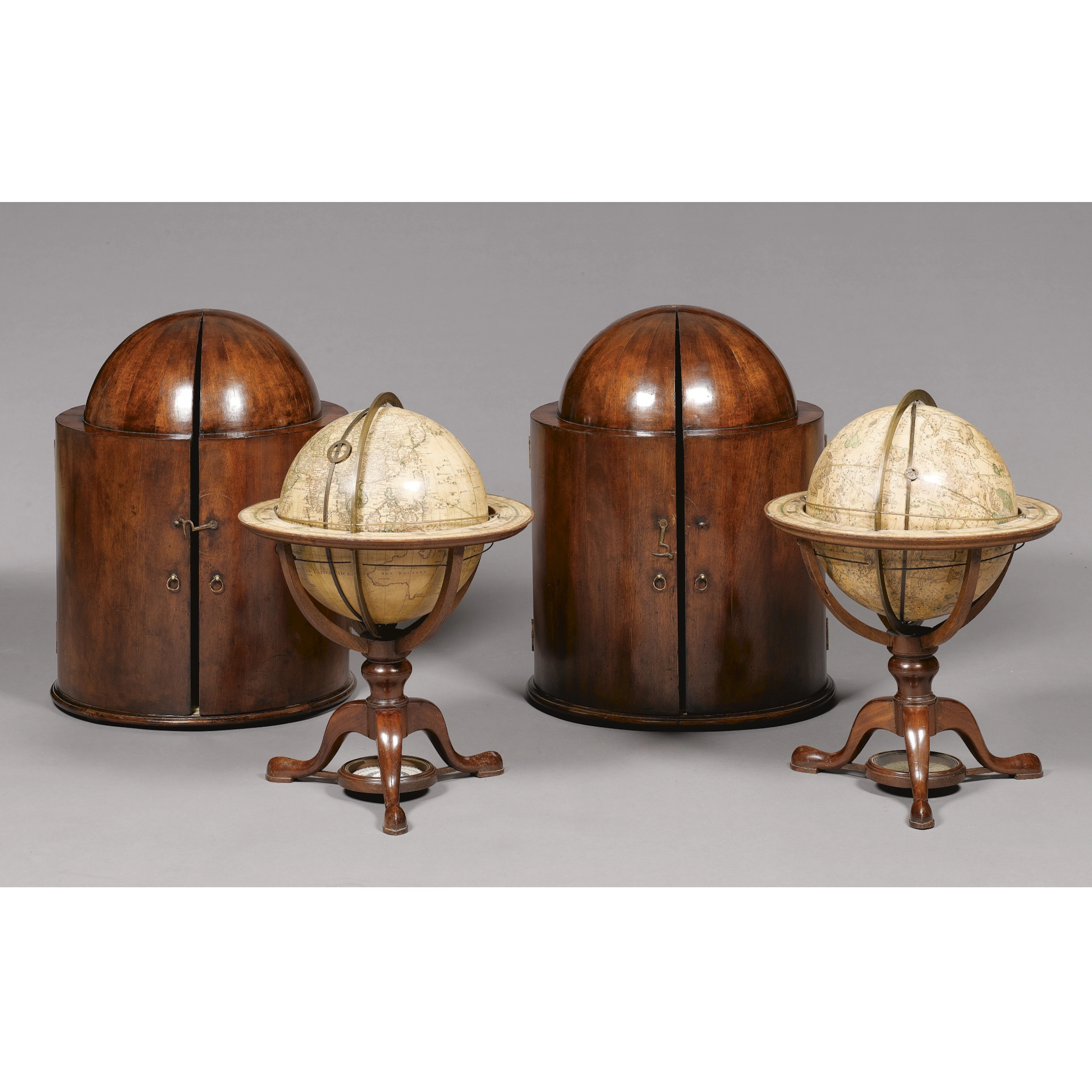 A pair of 12" Terrrestrial and Celestial table globes by George Adams, in mahogany cases