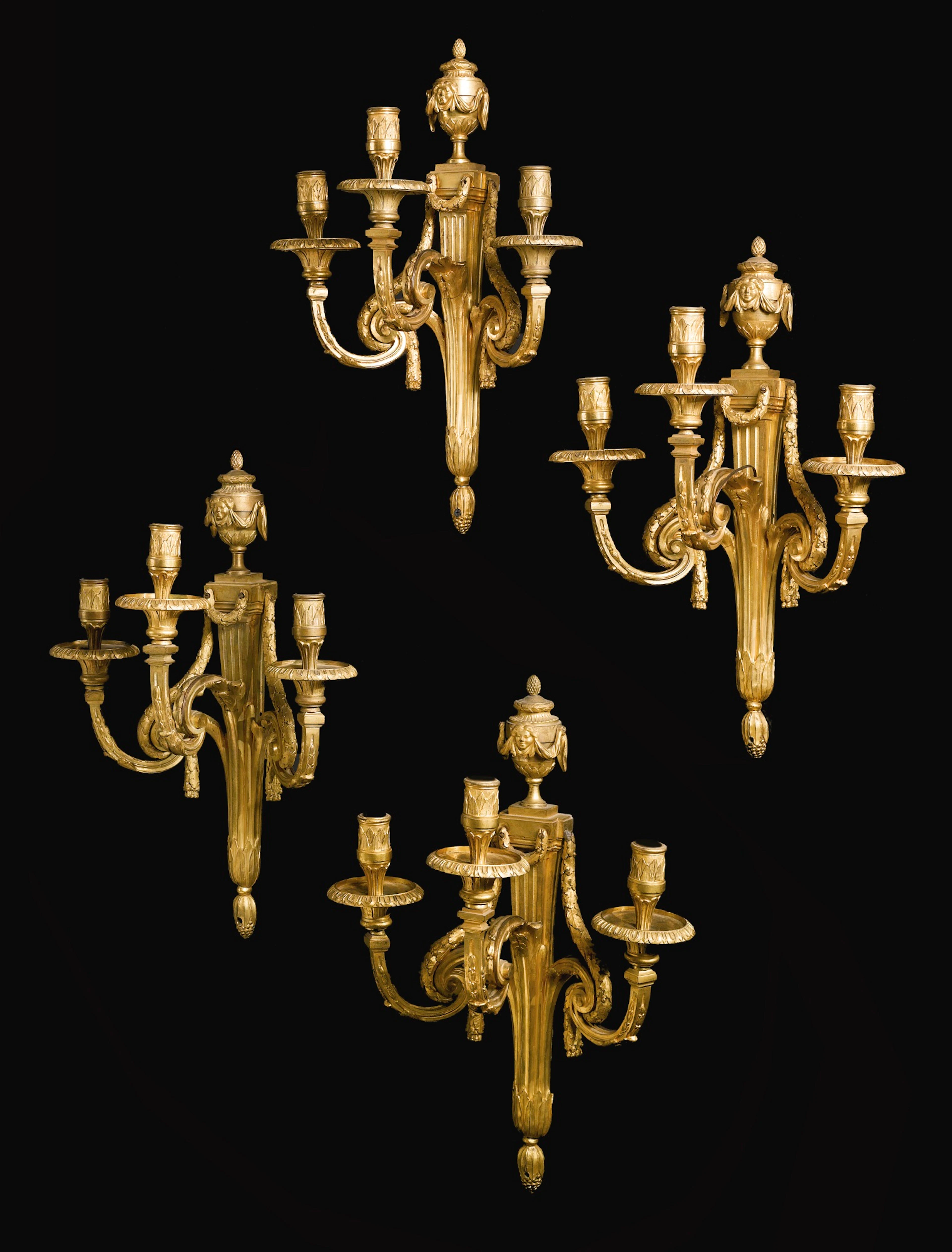A set of four louis xvi ormolu three-branch wall lights circa 1770