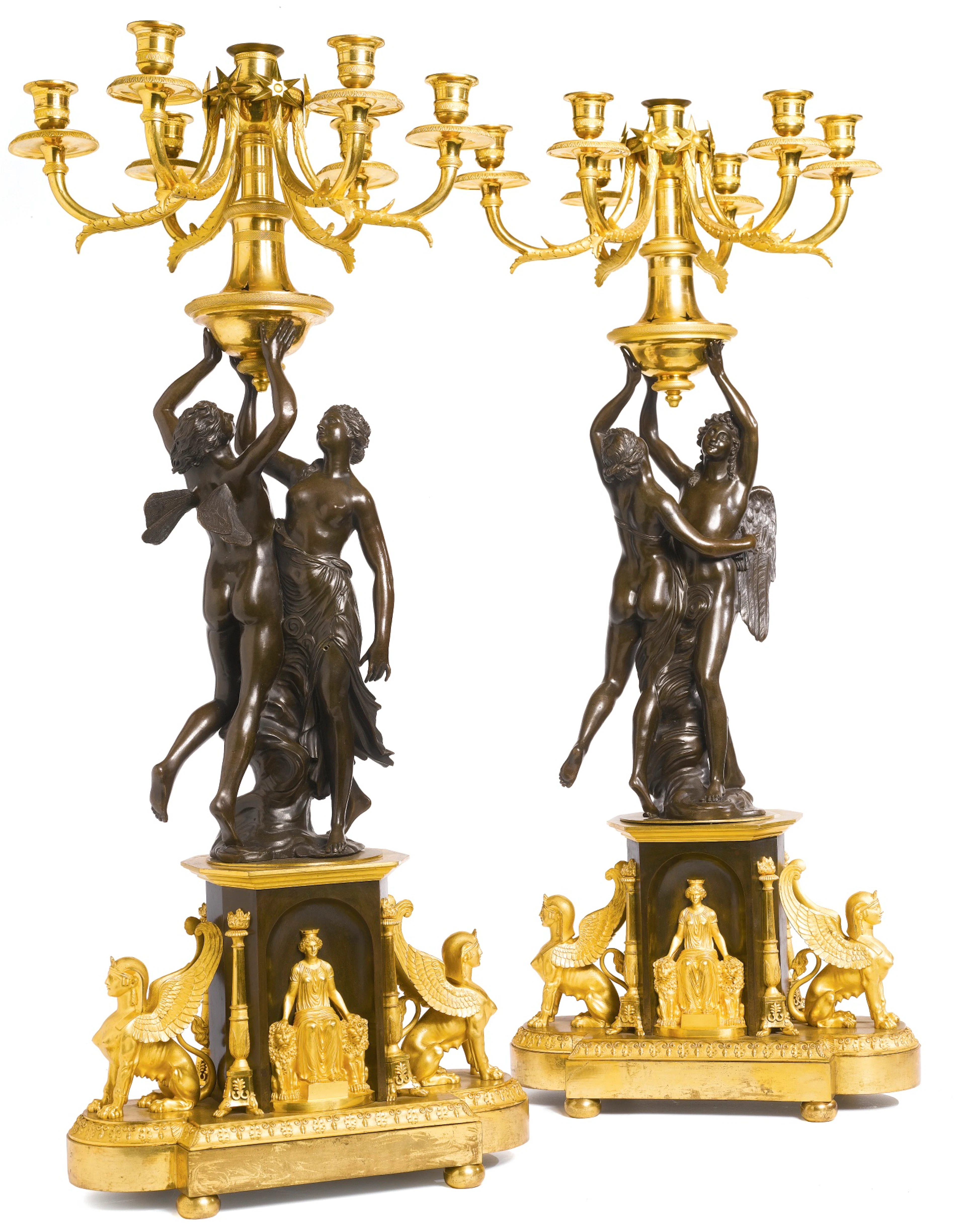 A pair of late louis xvi ormolu and patinated bronze seven-light candelabra