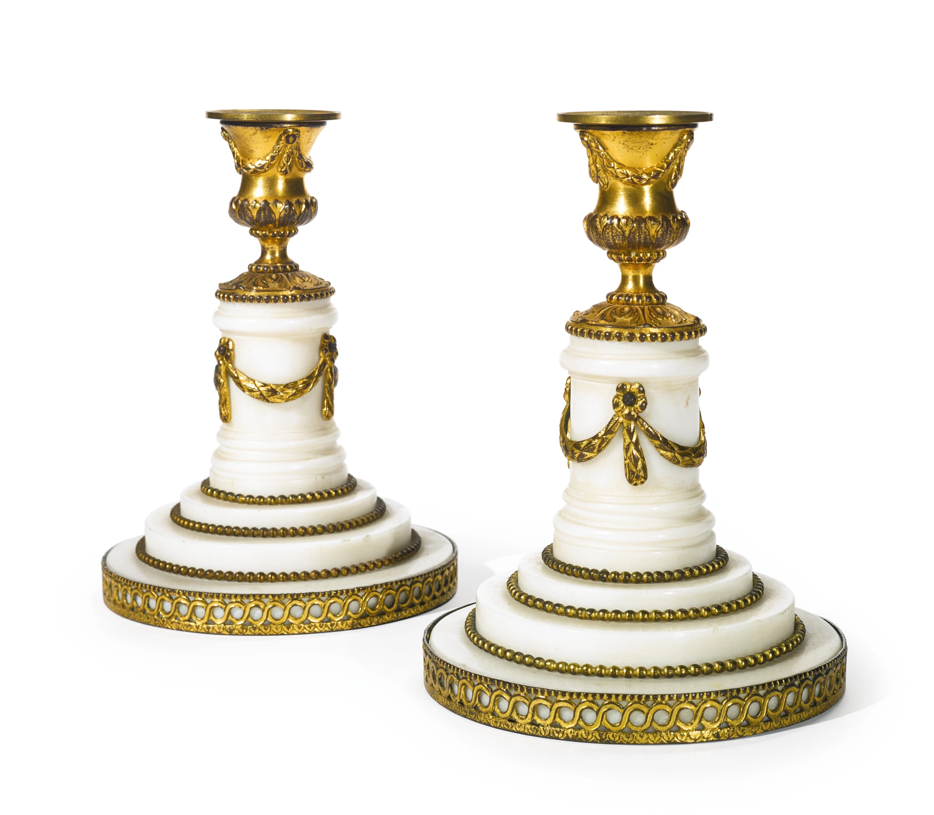 A pair of george iii ormolu-mounted white marble candlesticks attributed