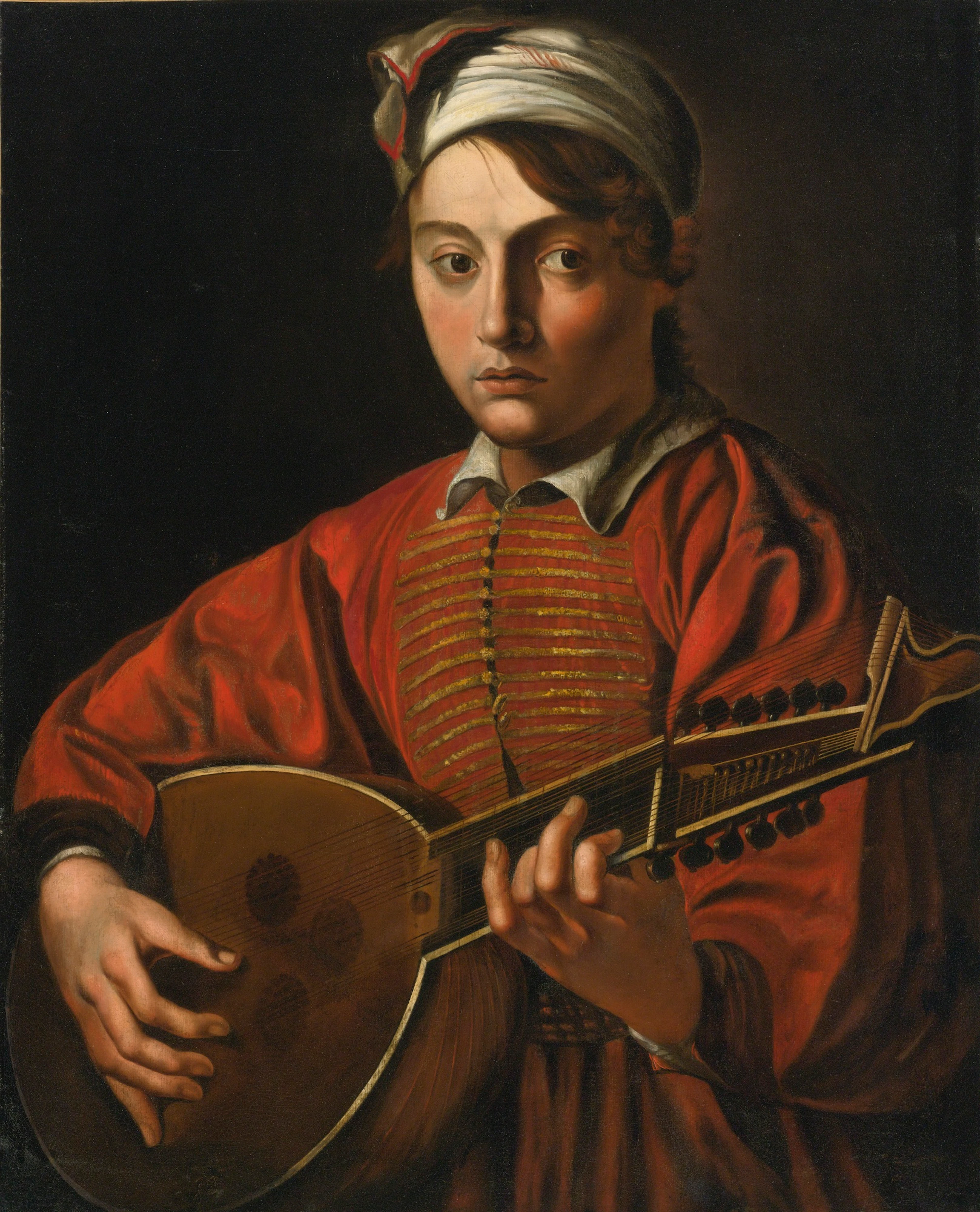 A young man playing a lute