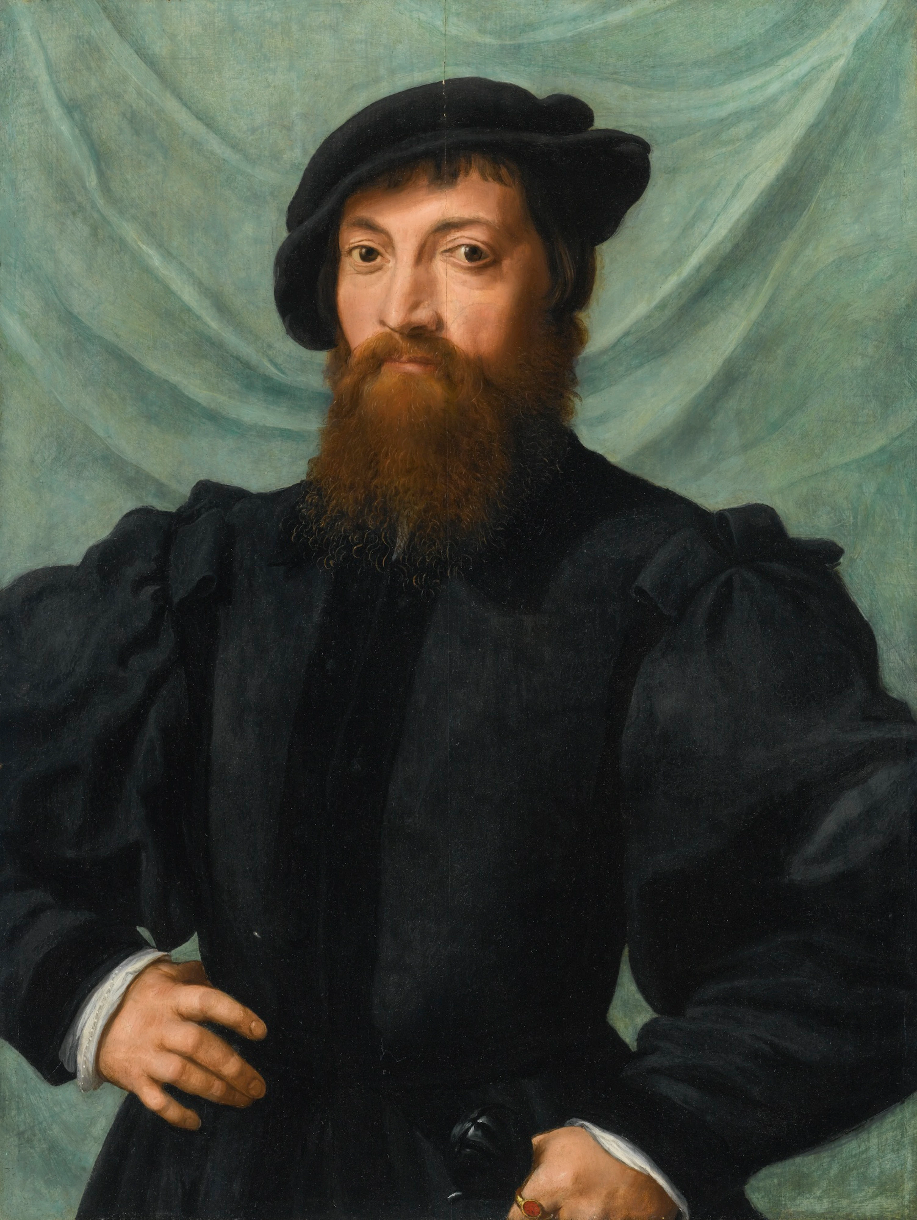 Portrait of a man, half-length, standing before a green curtain