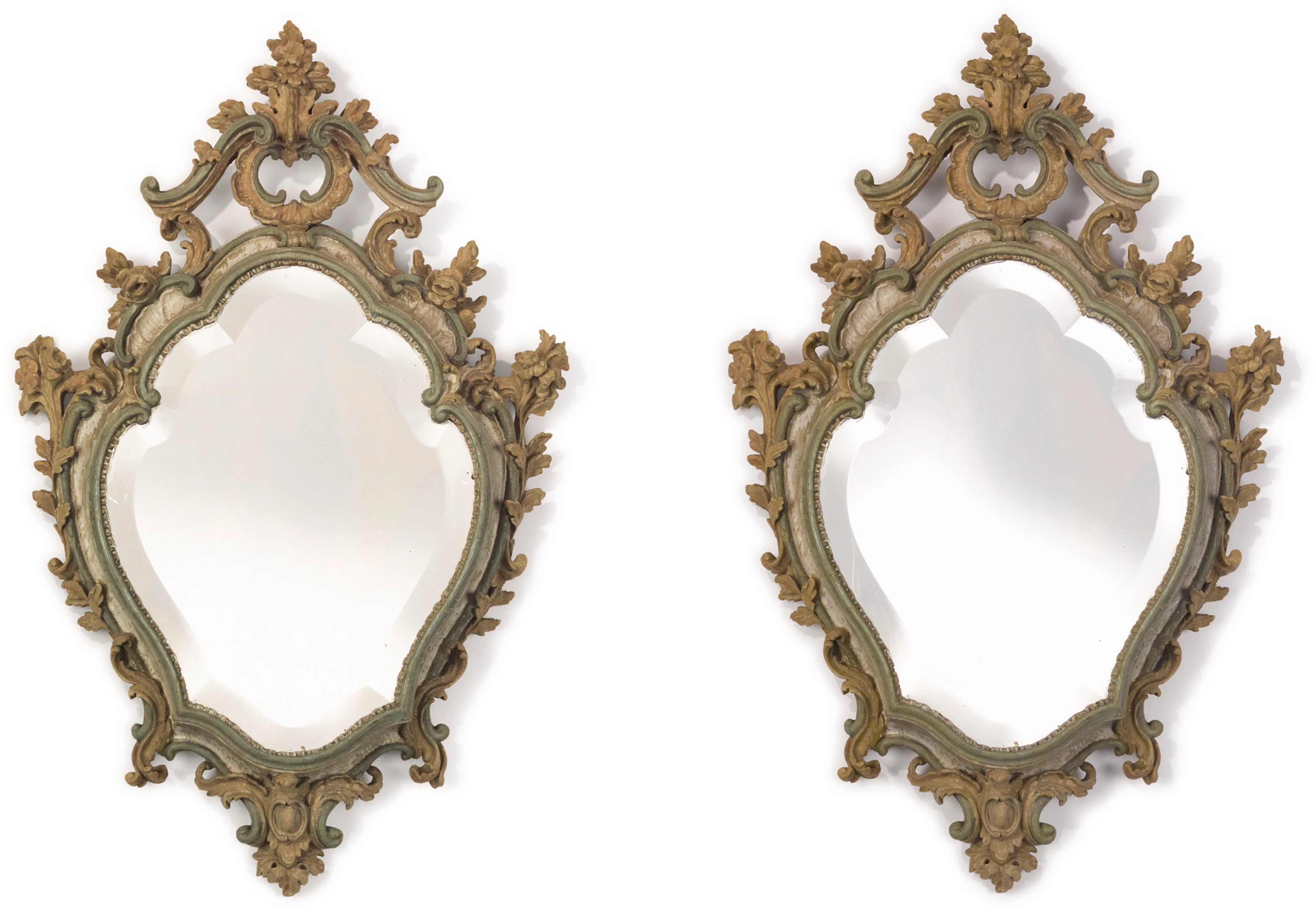 A pair of german rococo style carved and grey and green-painted mirrors