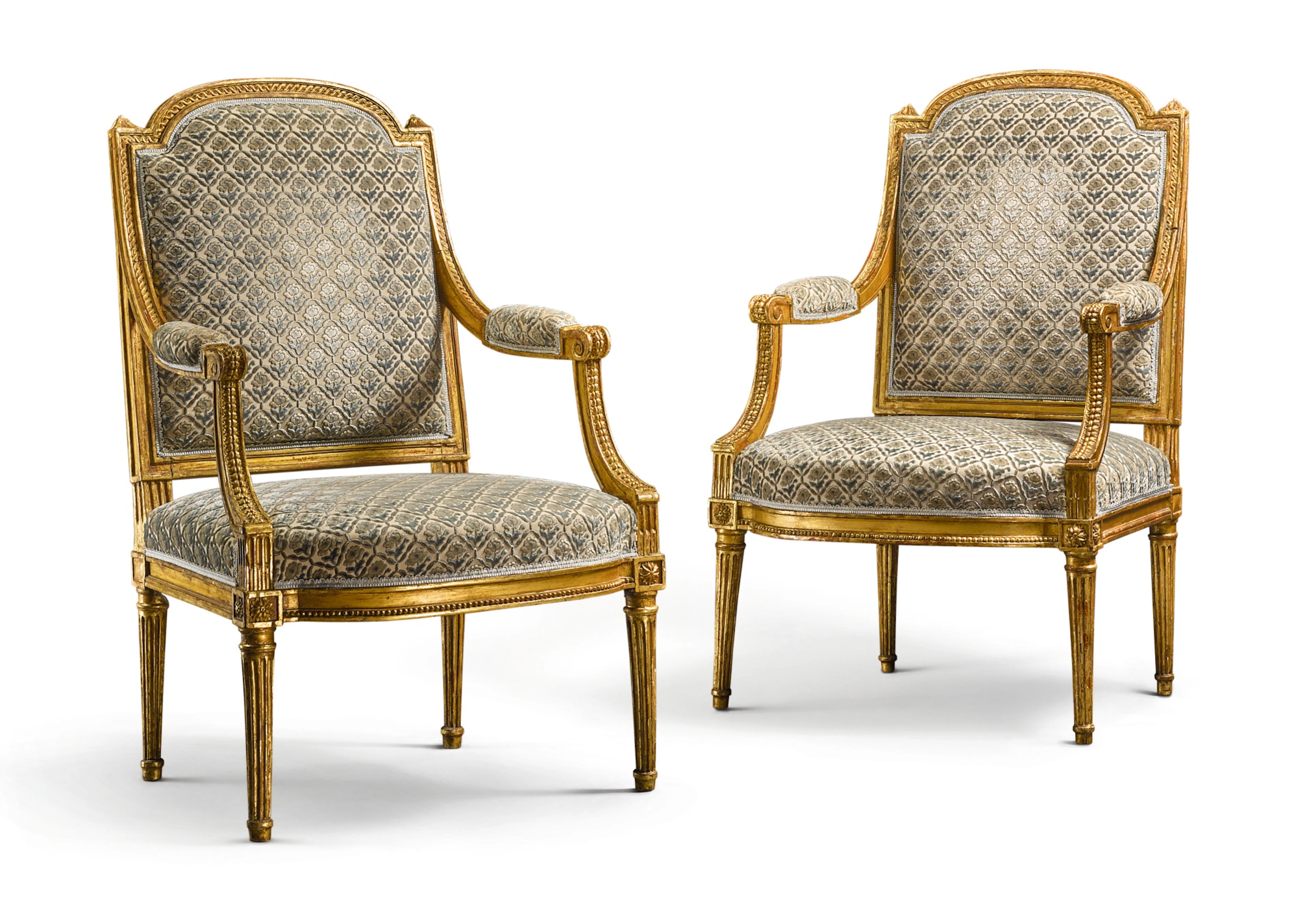 A pair of louis xvi carved giltwood fauteuils circa 1785, stamped j.b.b demay