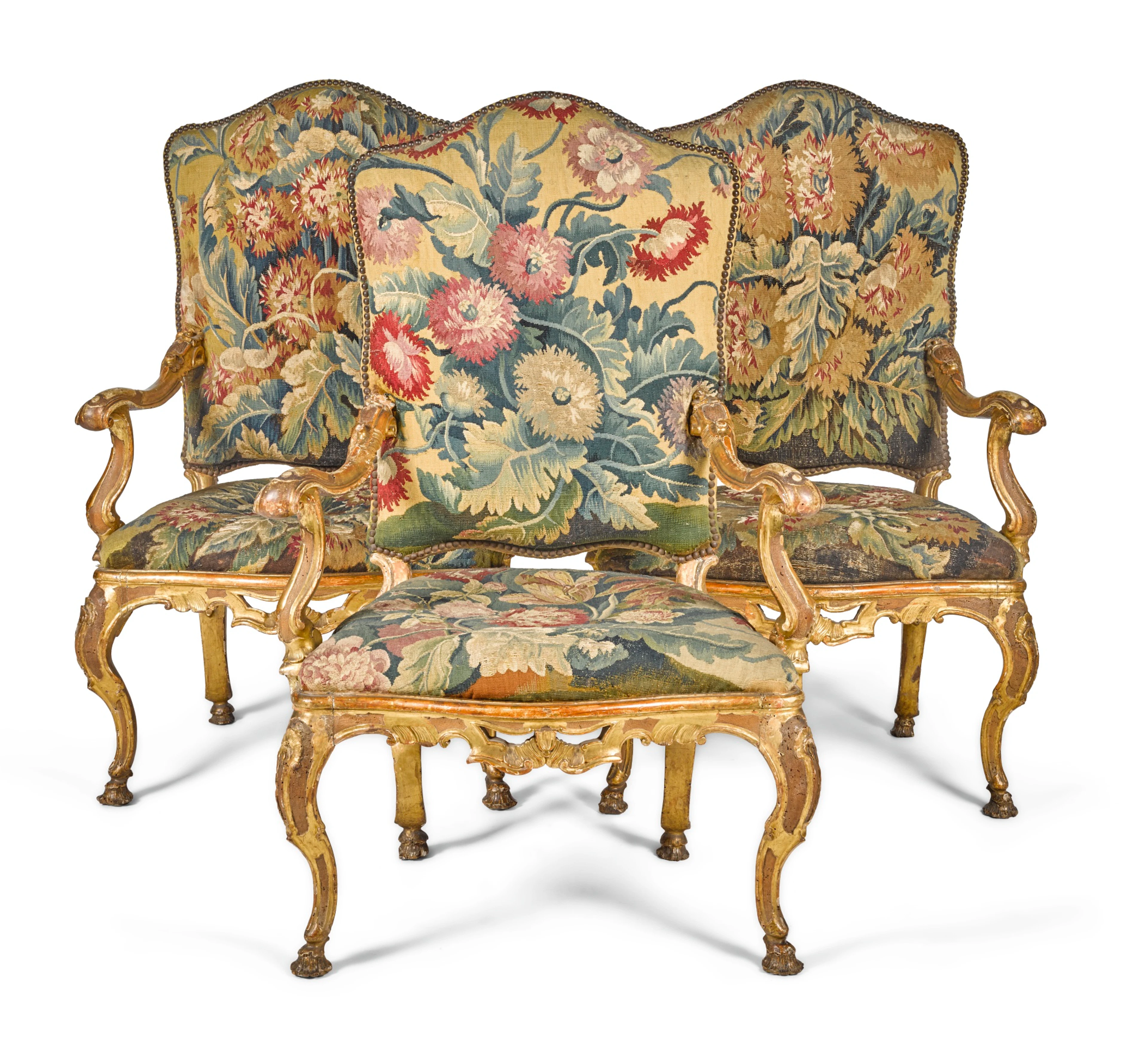 A set of four italian giltwood and lacquered armchairs, venice, first