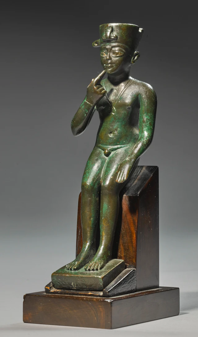AN EGYPTIAN BRONZE FIGURE OF HARPOCRATES, LATE PERIOD, 716-30 B.C.