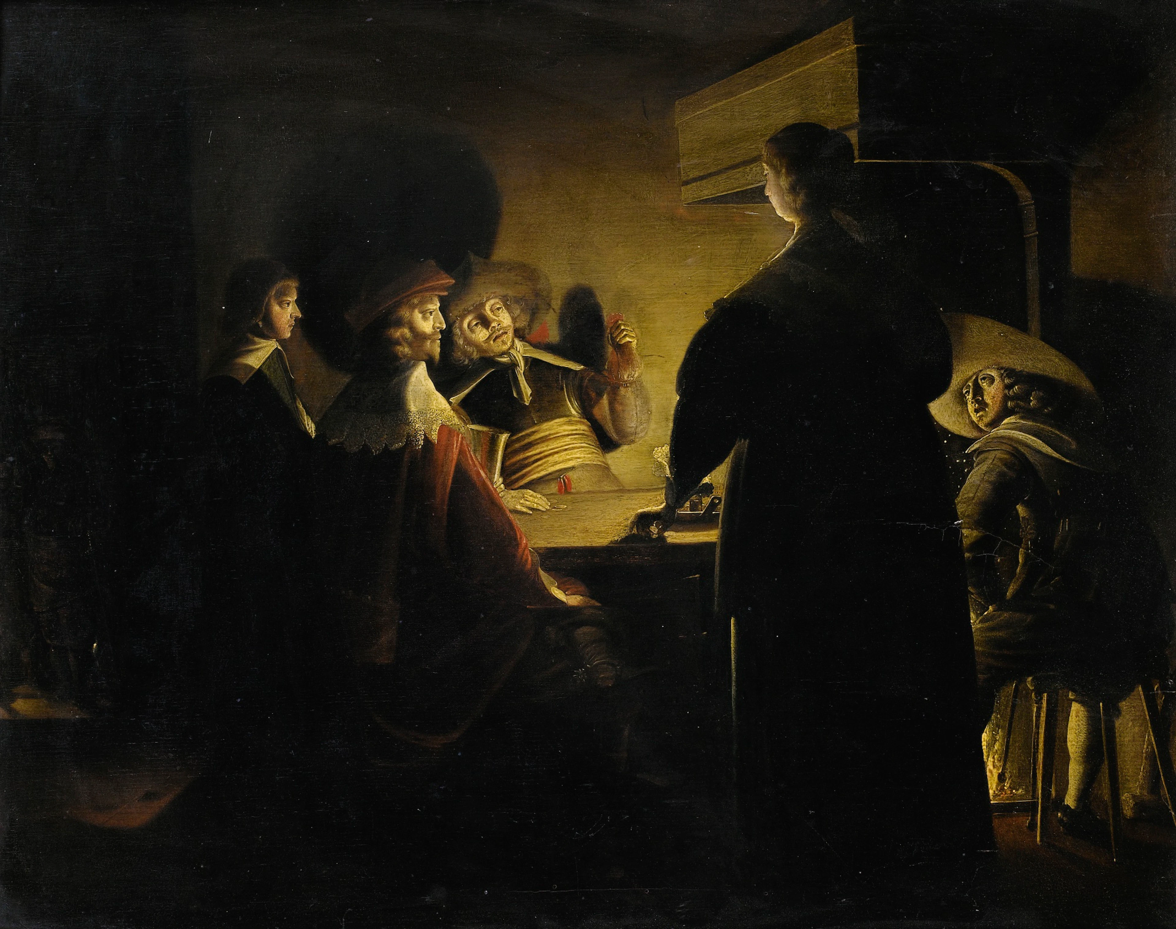 Tavern scene lit by candles