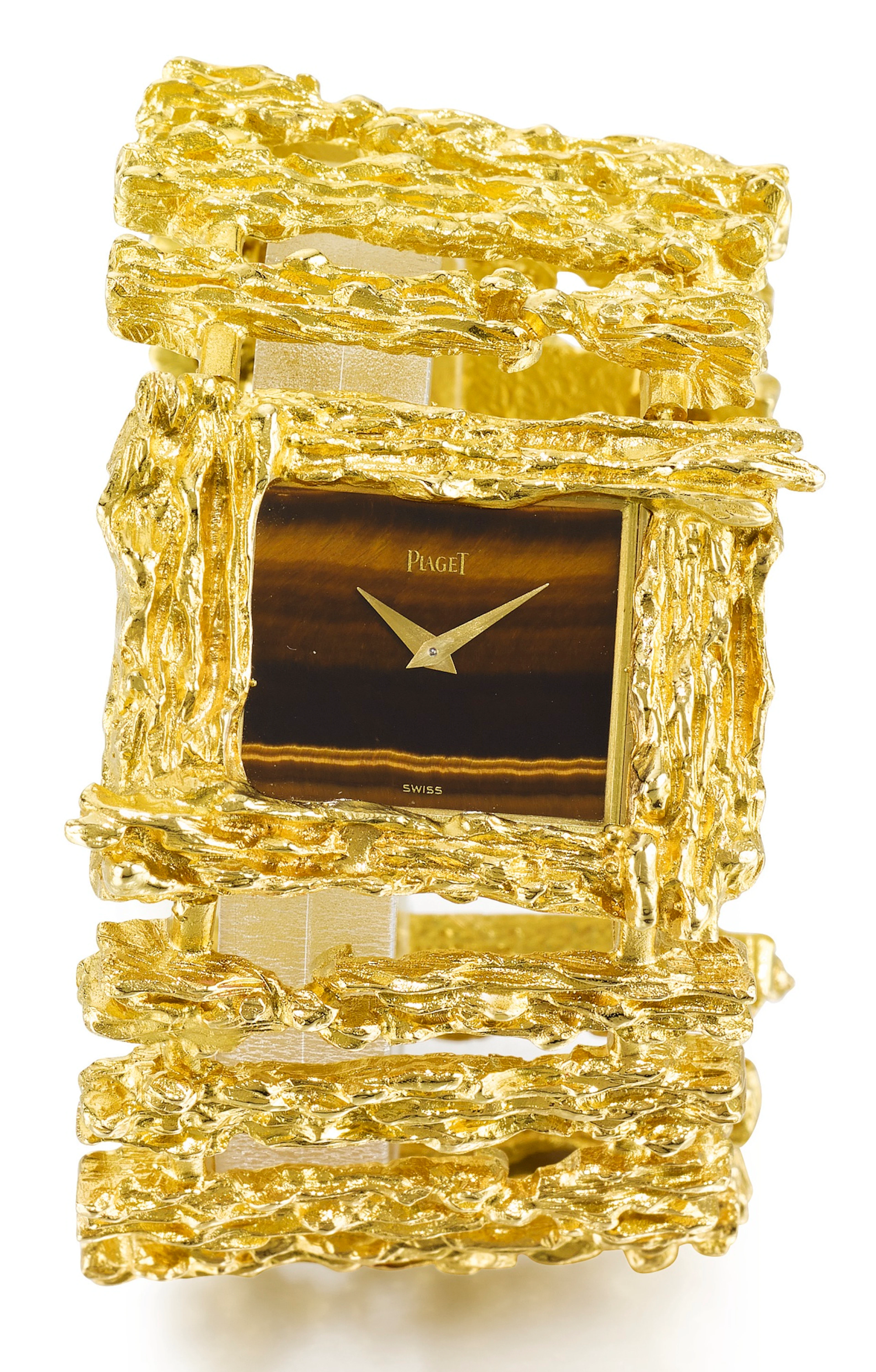 A yellow gold cuff watch with tiger's eye dial ref...