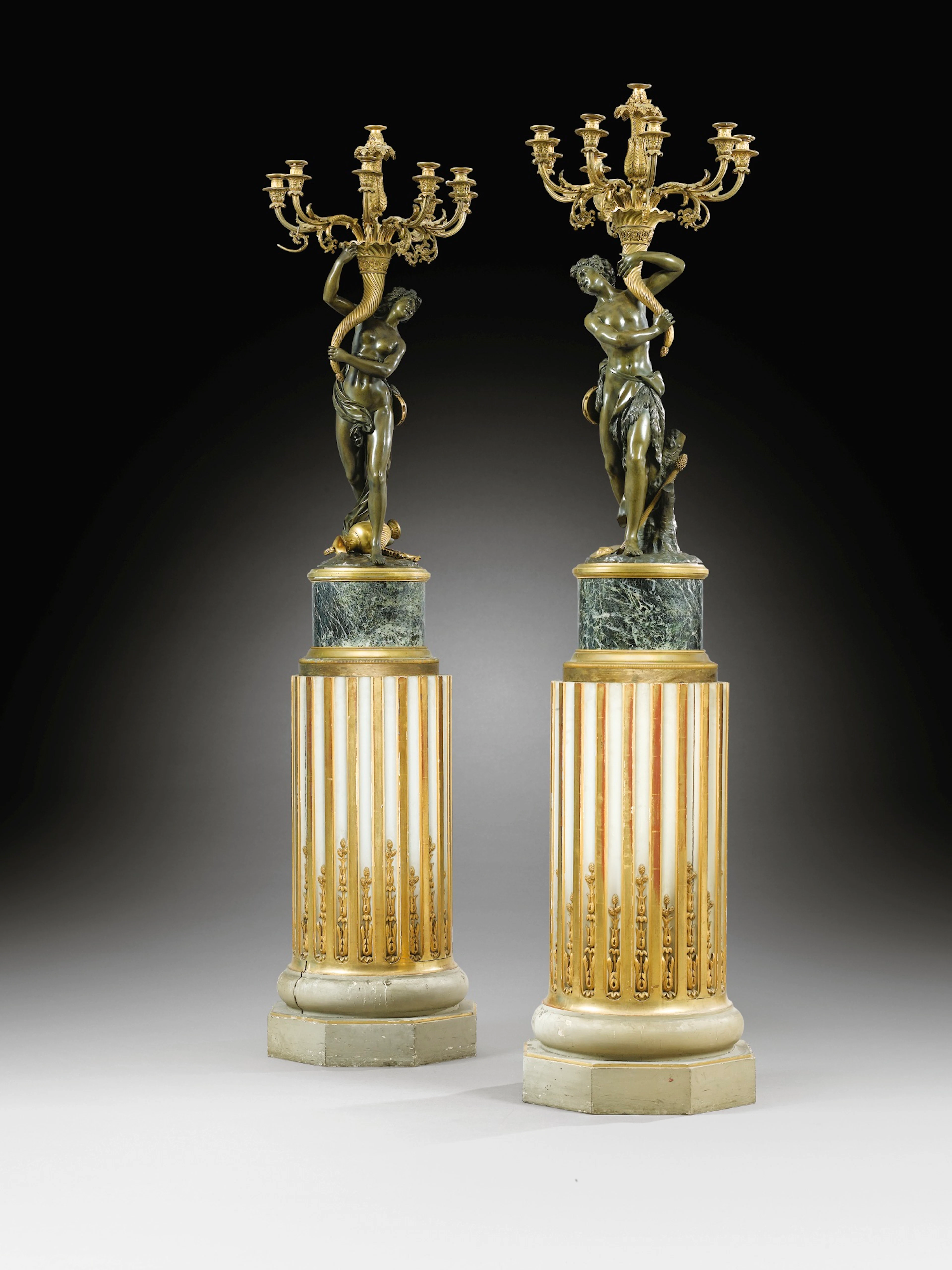 A PAIR OF PATINATED AND GILT BRONZE CANDELABRA WITH SILENUS AND BACCHANTE, LOUIS