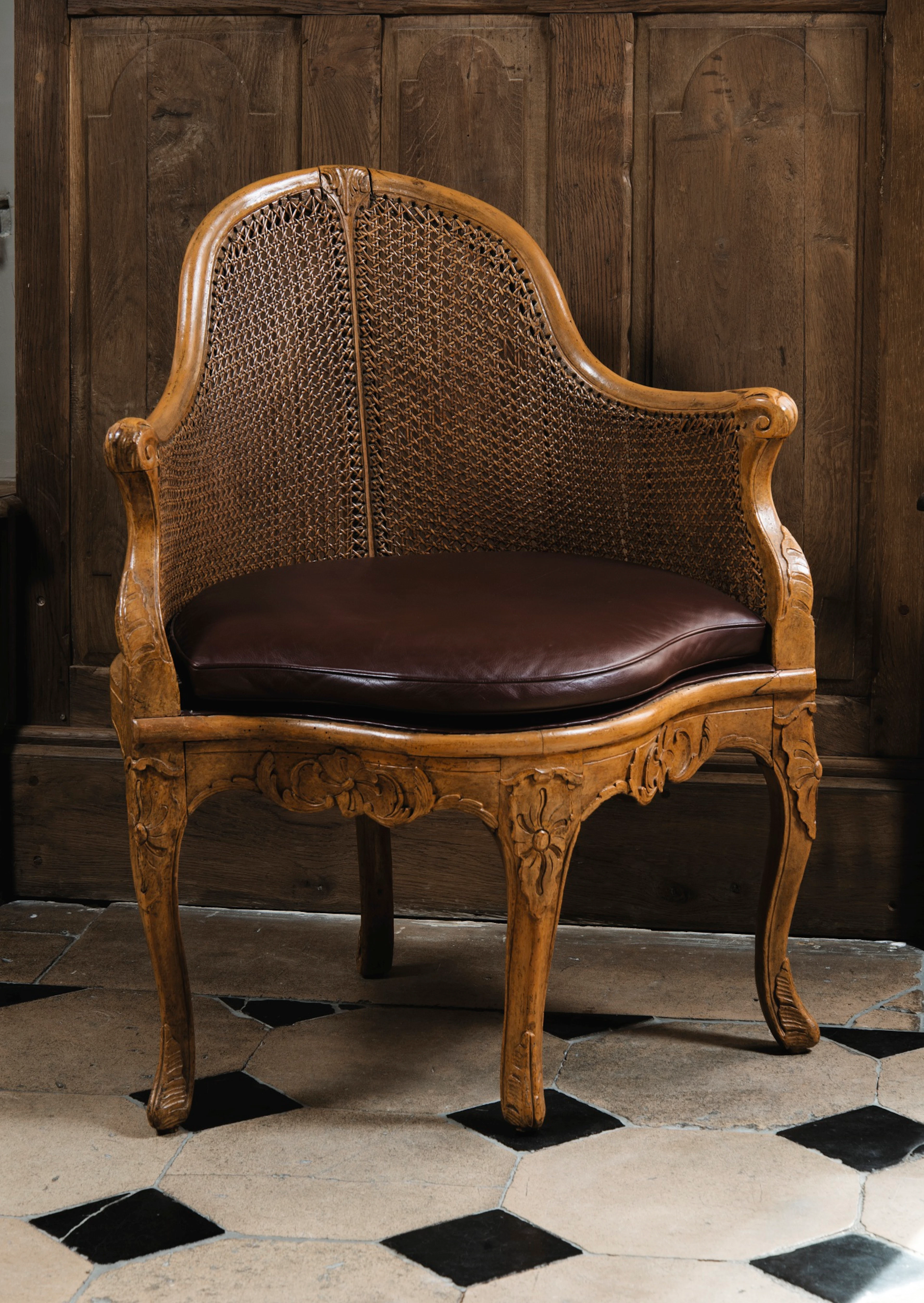 A carved and painted beech fauteuil de bureau, louis xv, circa 1750