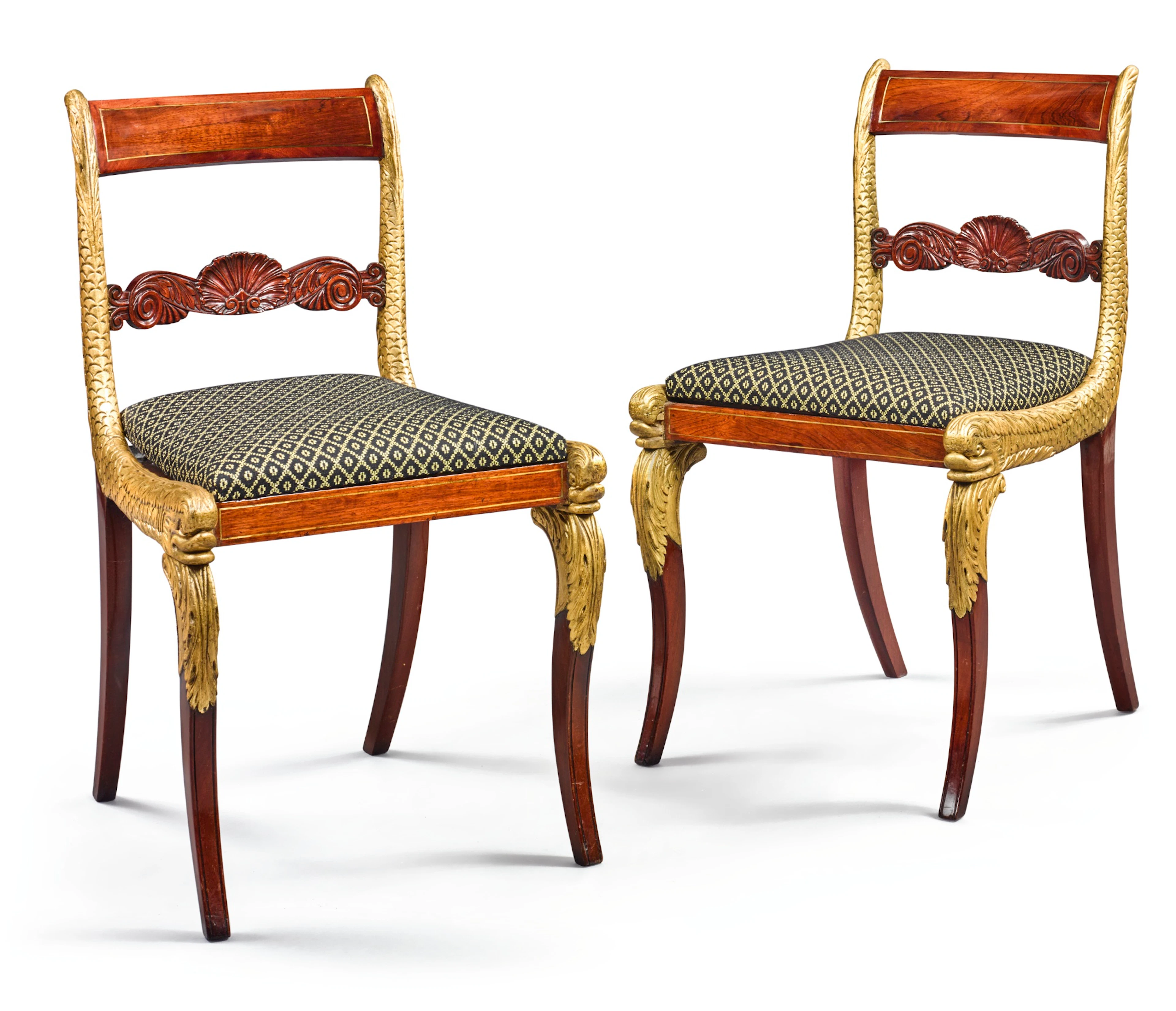 Important pair of classical brass inlaid, carved and parcel gilt mahogany