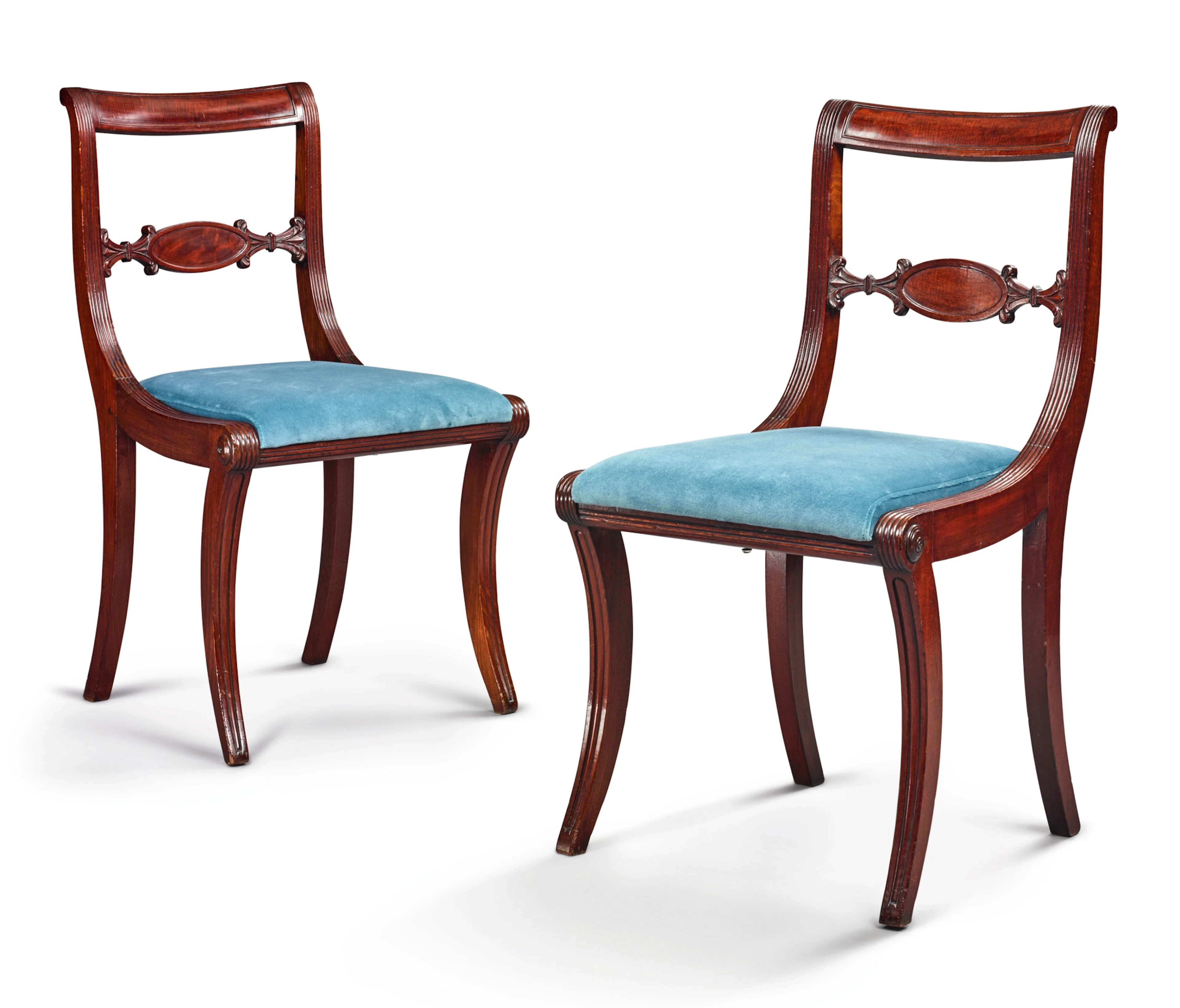 Fine and rare pair of classical carved and figured mahogany klismos