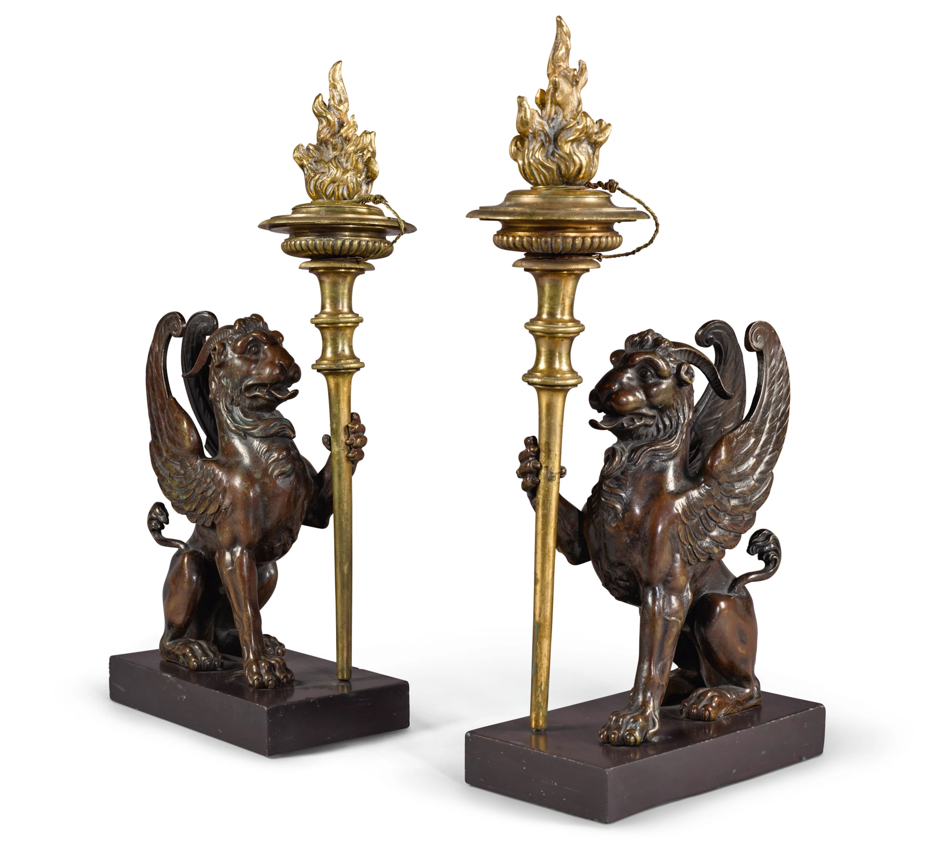 A pair of late george iii patinated bronze and gilt-brass candlesticks