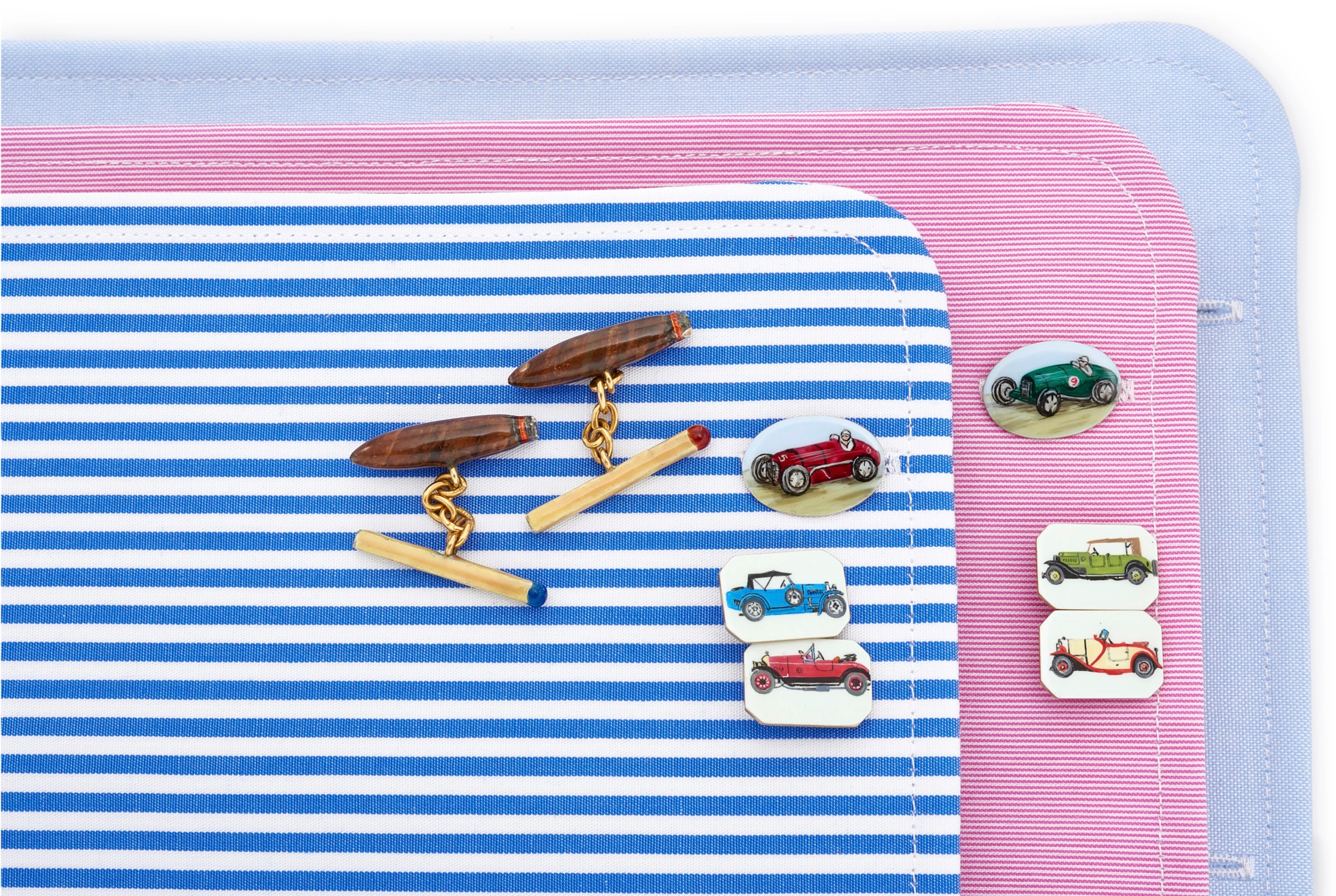 A pair of cigar and match cufflinks