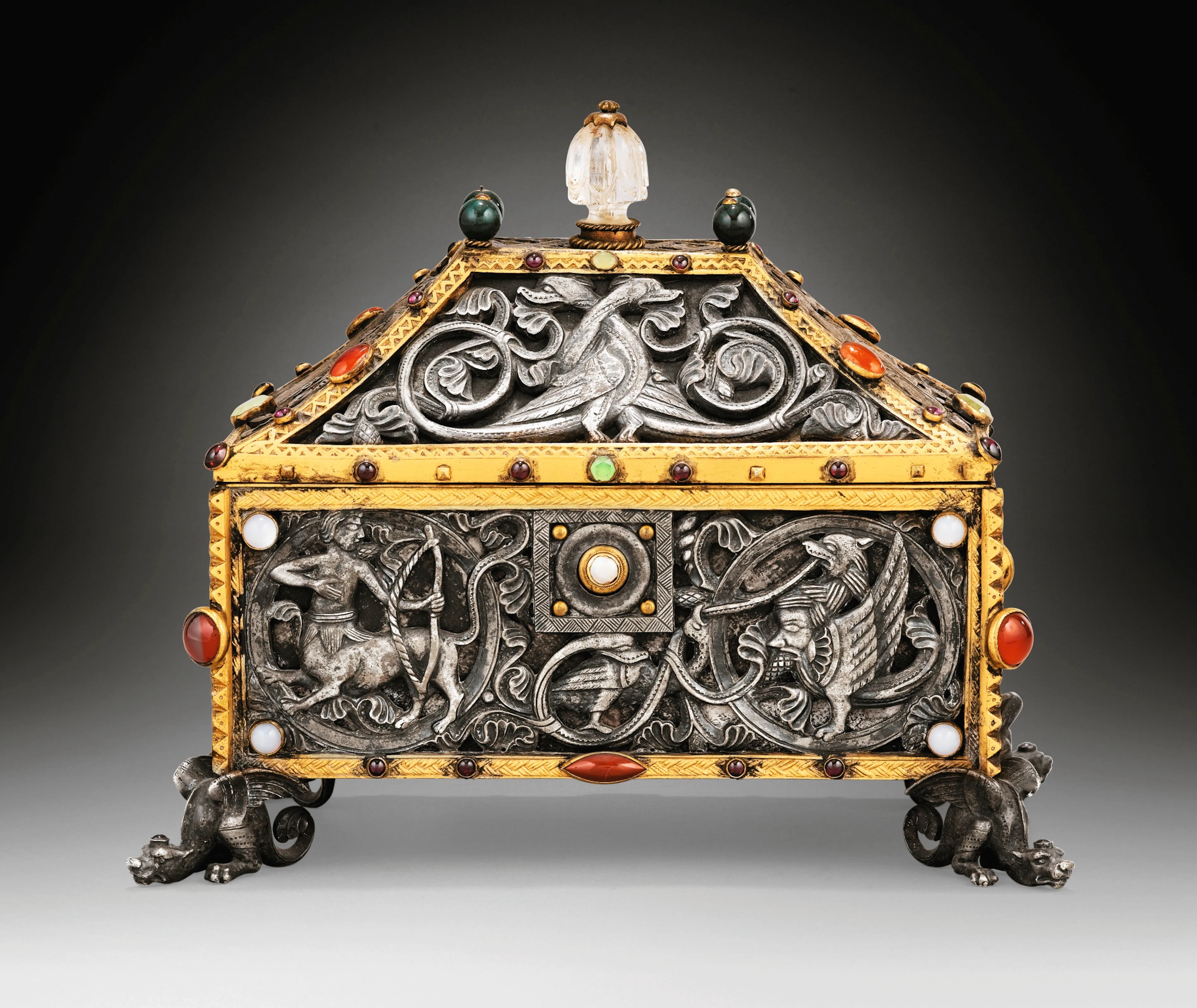 A JEWELLED GILT AND SILVERED METAL CASKET