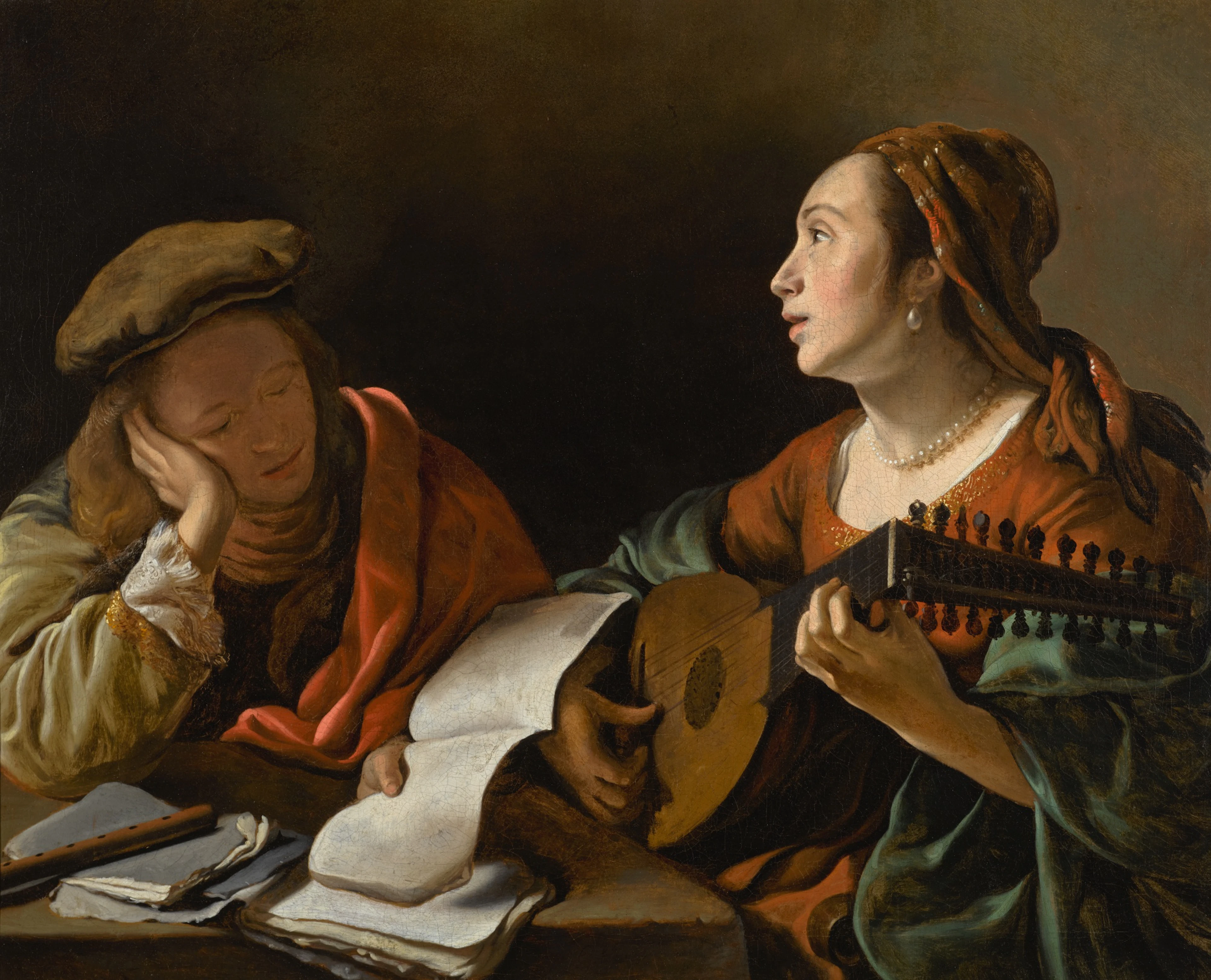 GOVERT FLINCK | A young lady playing the lute to a young man reading