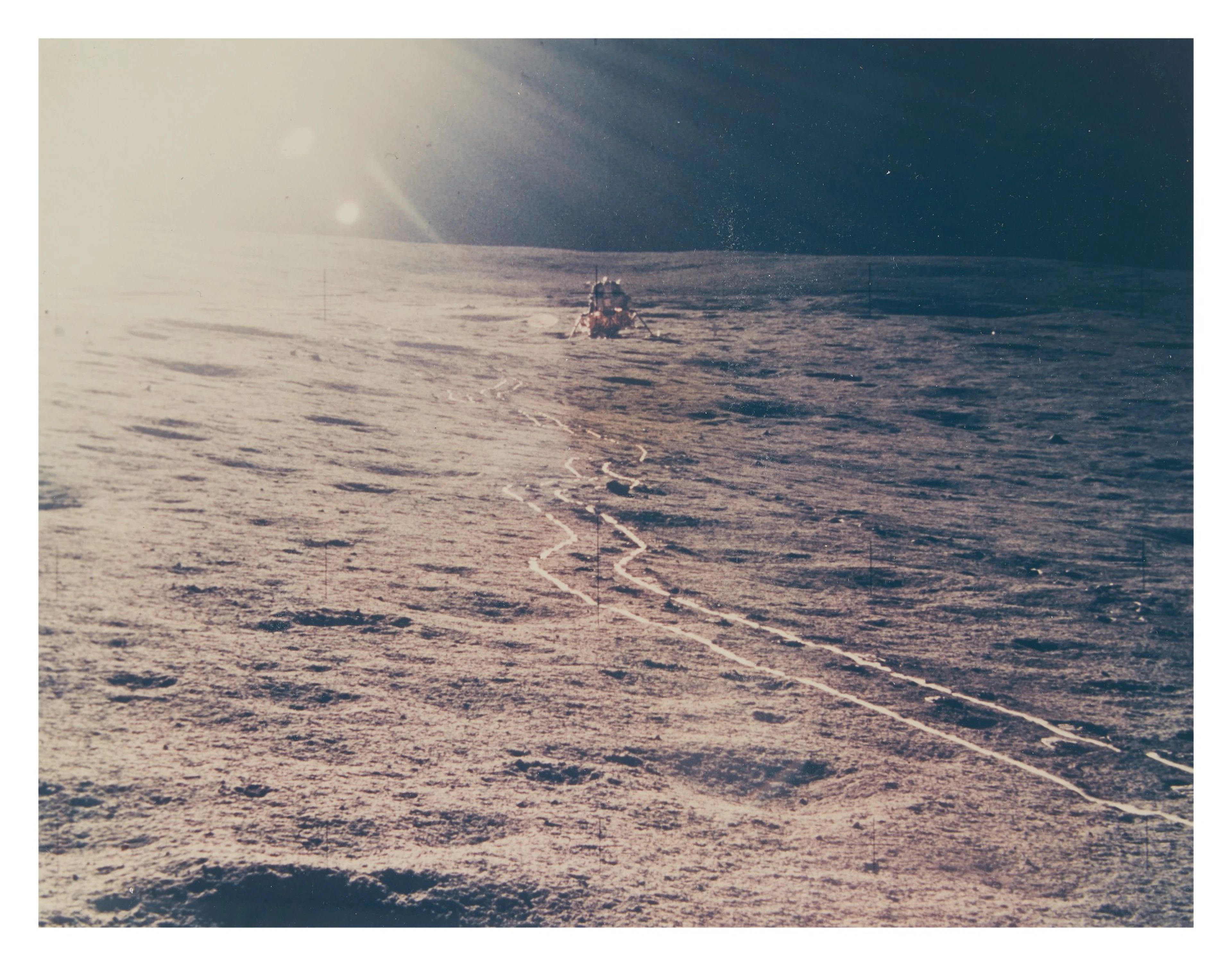 [apollo 14] sun shining brightly on the lunar surface and the apollo 14 lm