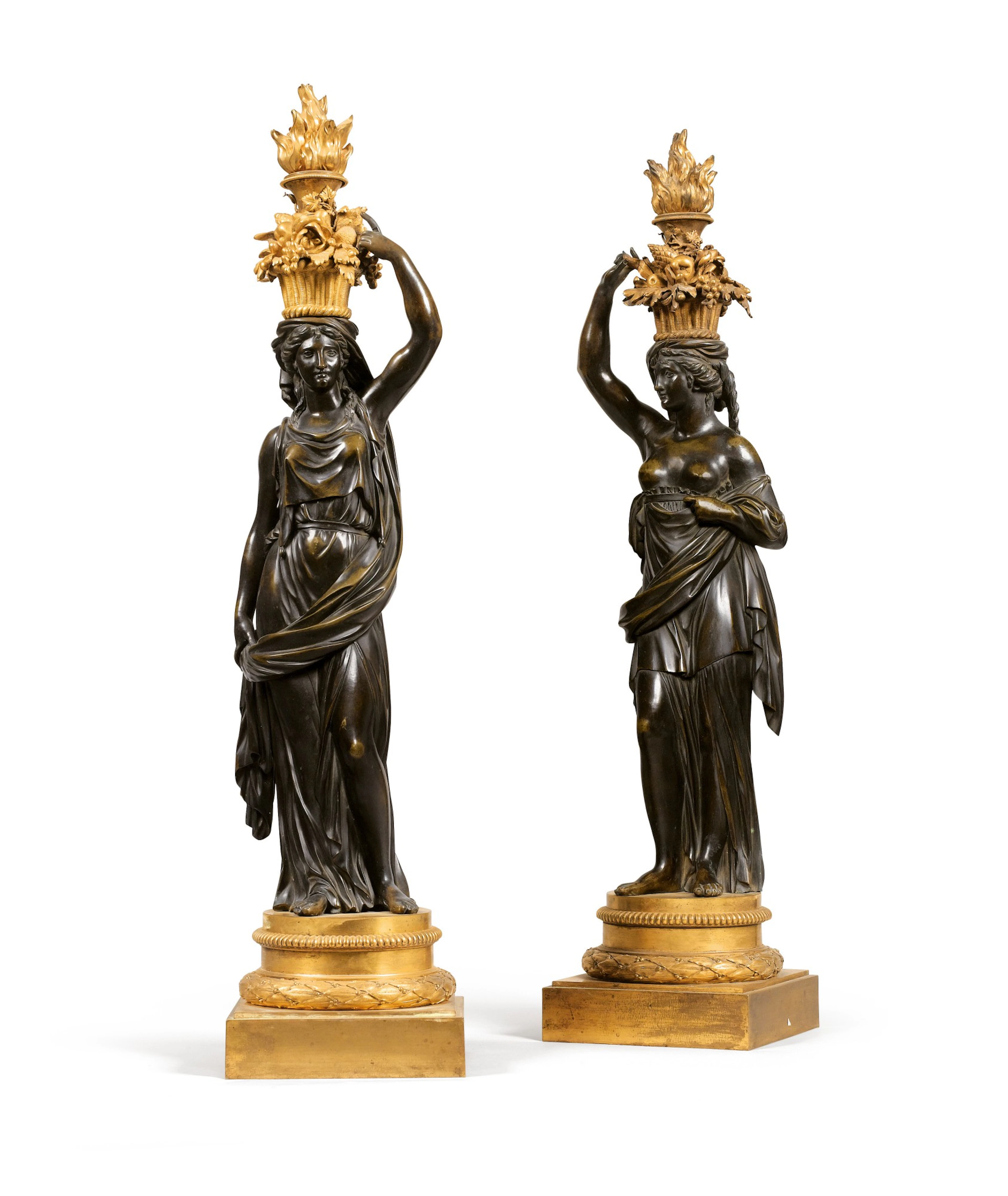 A pair of restauration patinated and gilt-bronze figures