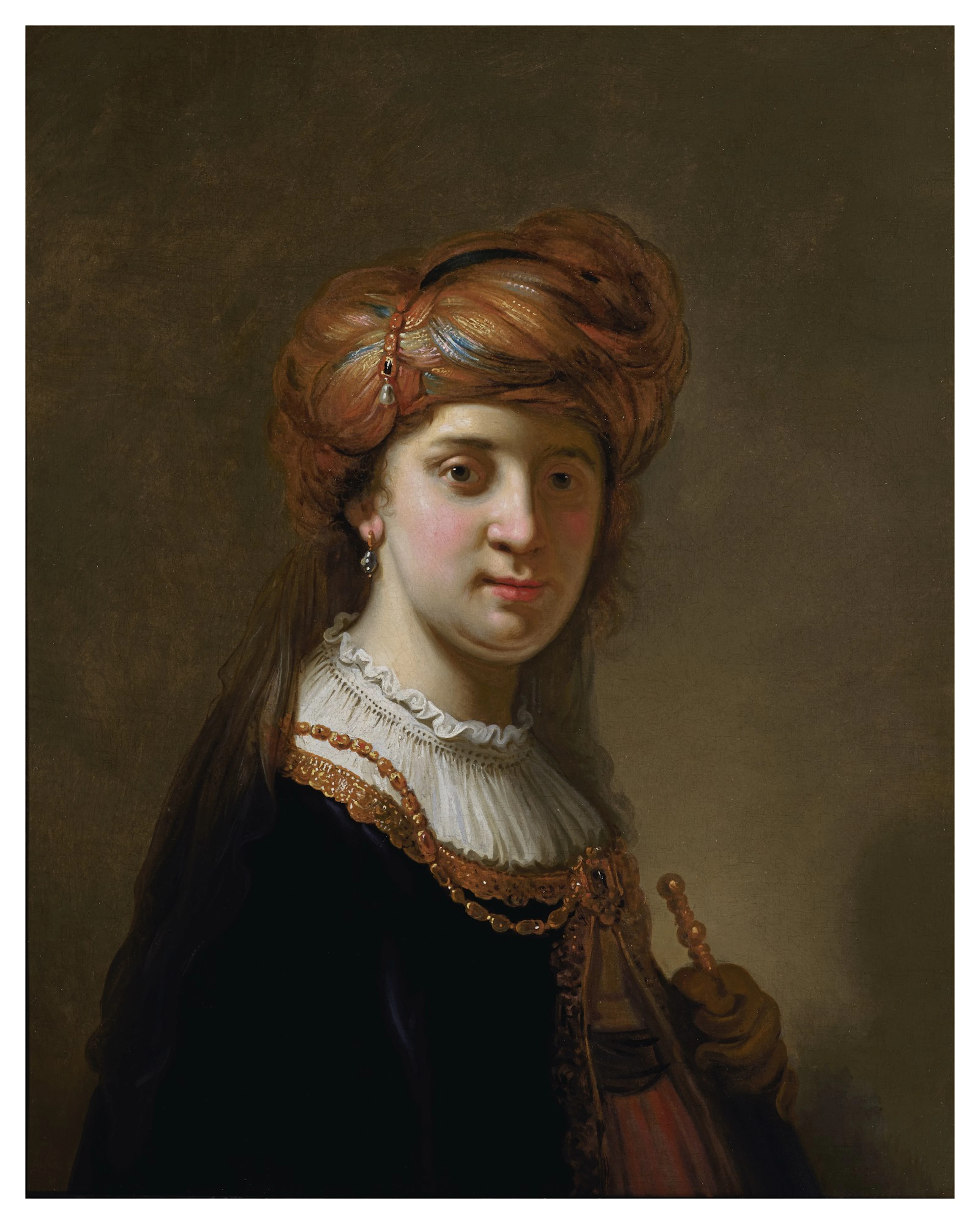 Govert flinck | portrait of a lady in a turban, half-length