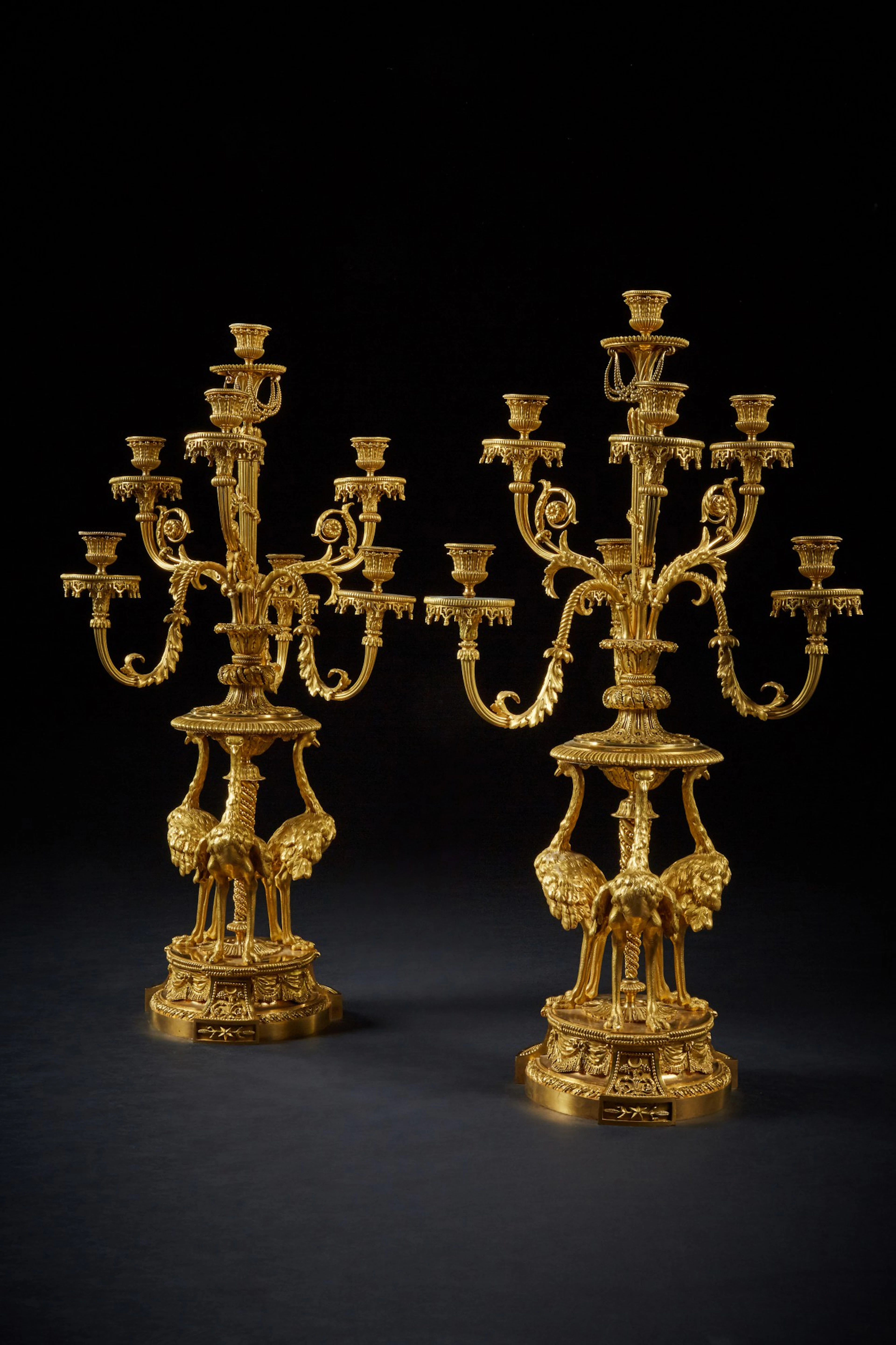 A pair of louis xvi style gilt-bronze seven-light candelabra 'aux autruches'