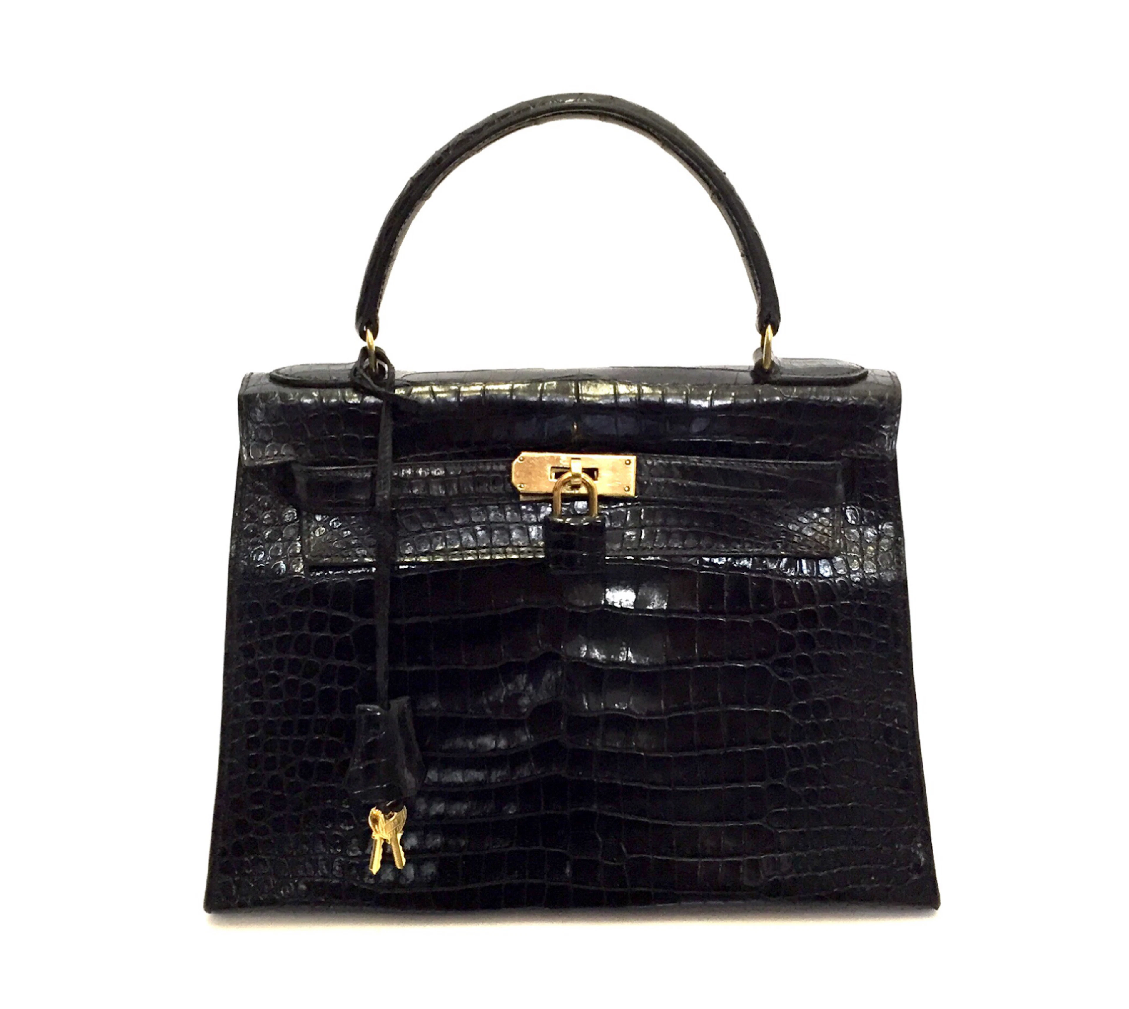Hermès | black kelly 28 in shiny crocodile with gold hardware, 1962