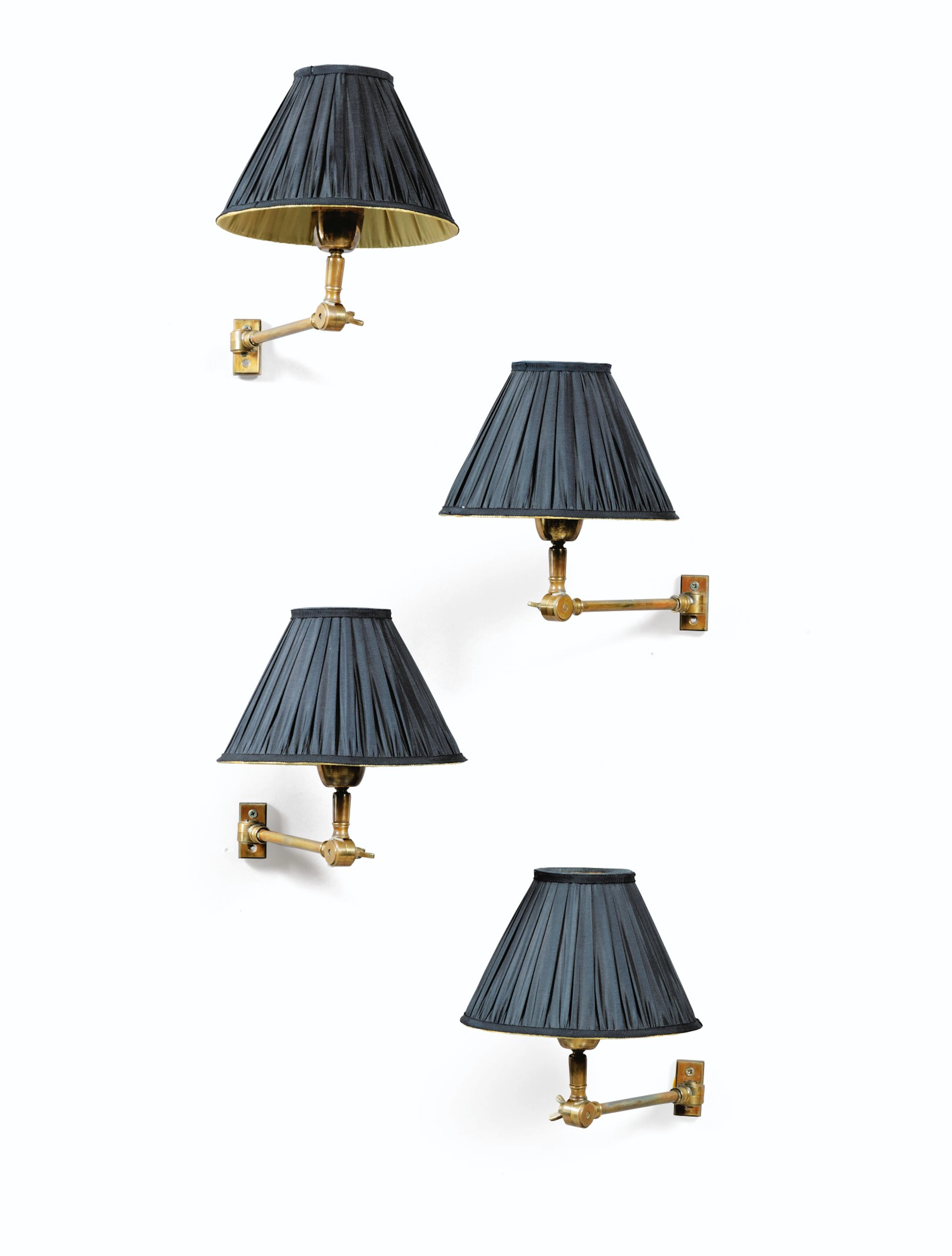 A set of four modern gilt-brass wall appliques