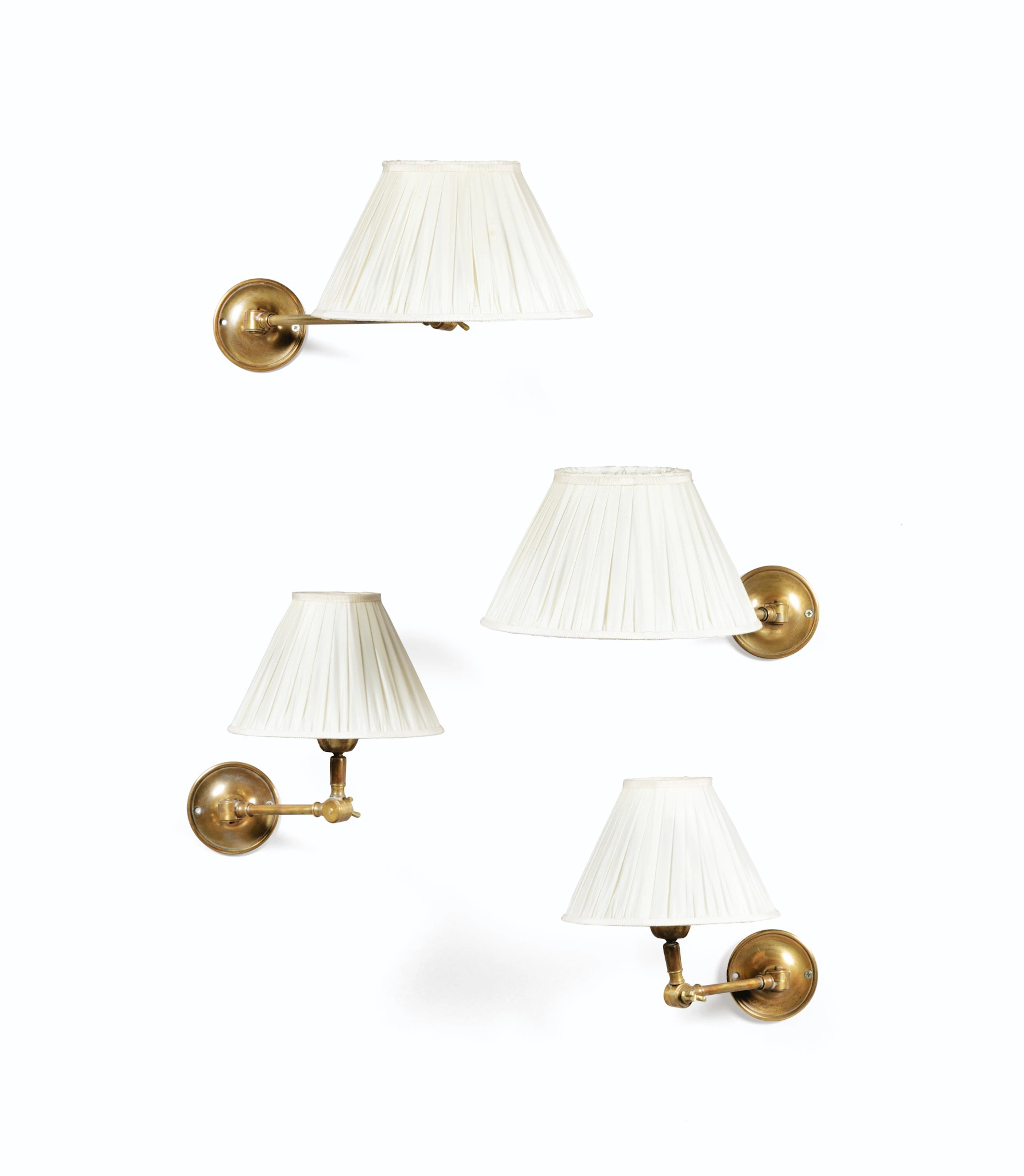 A set of four modern gilt-brass wall appliques from la galerie des Lampes, Paris