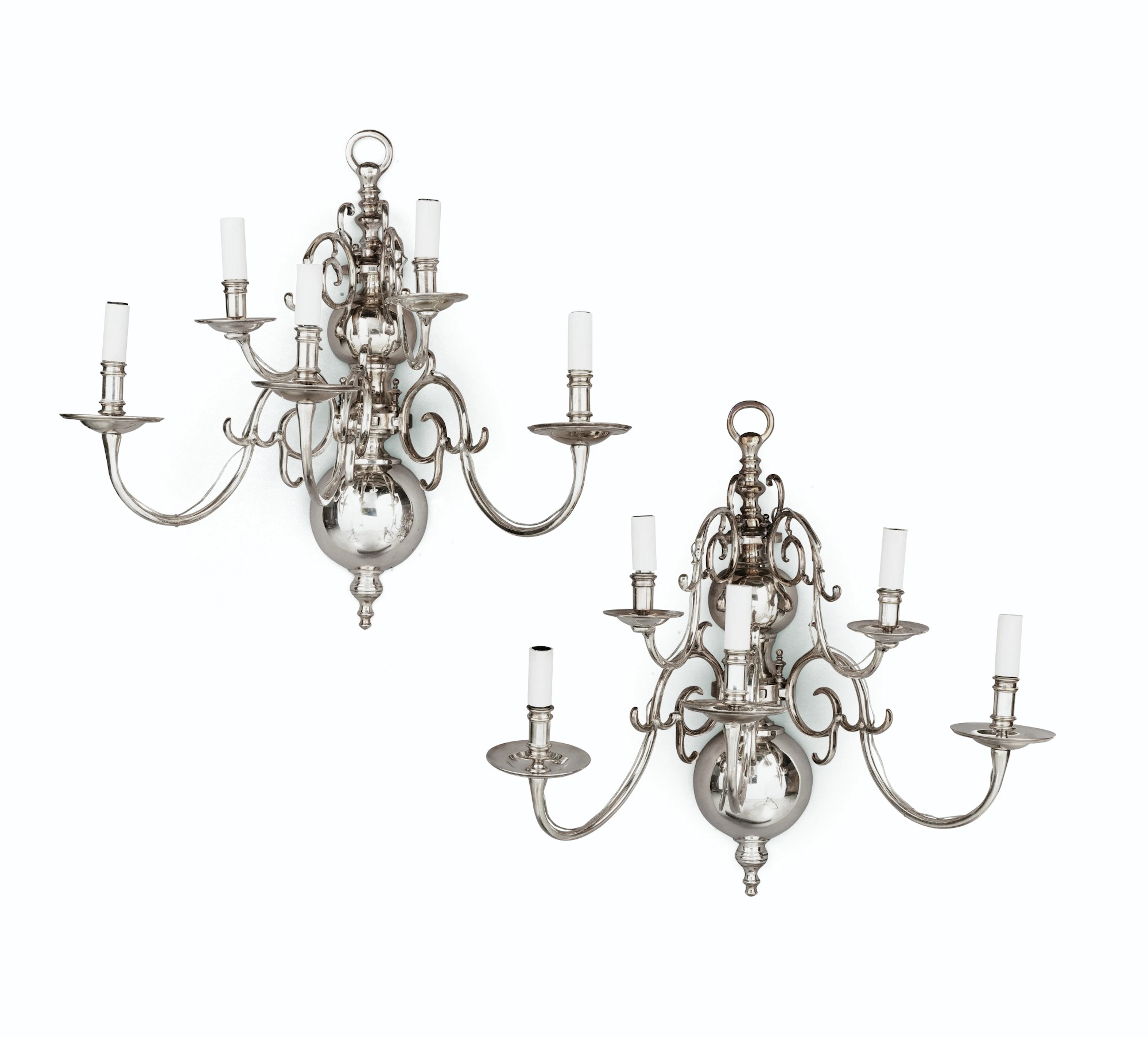 A pair of modern Dutch style chrome-plated brass wall appliques